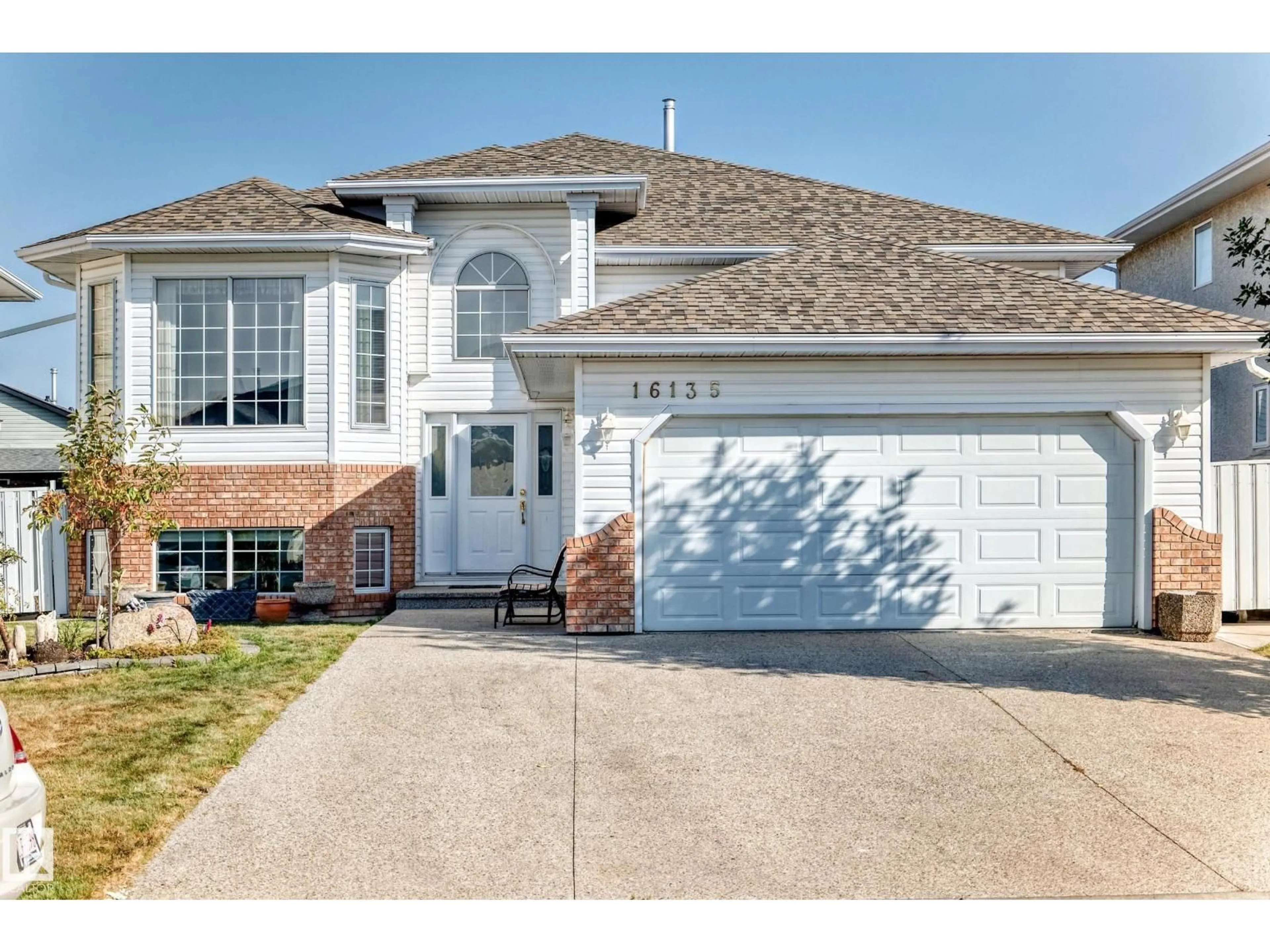Home with vinyl exterior material, street for 16135 56 ST, Edmonton Alberta T5Y2T9