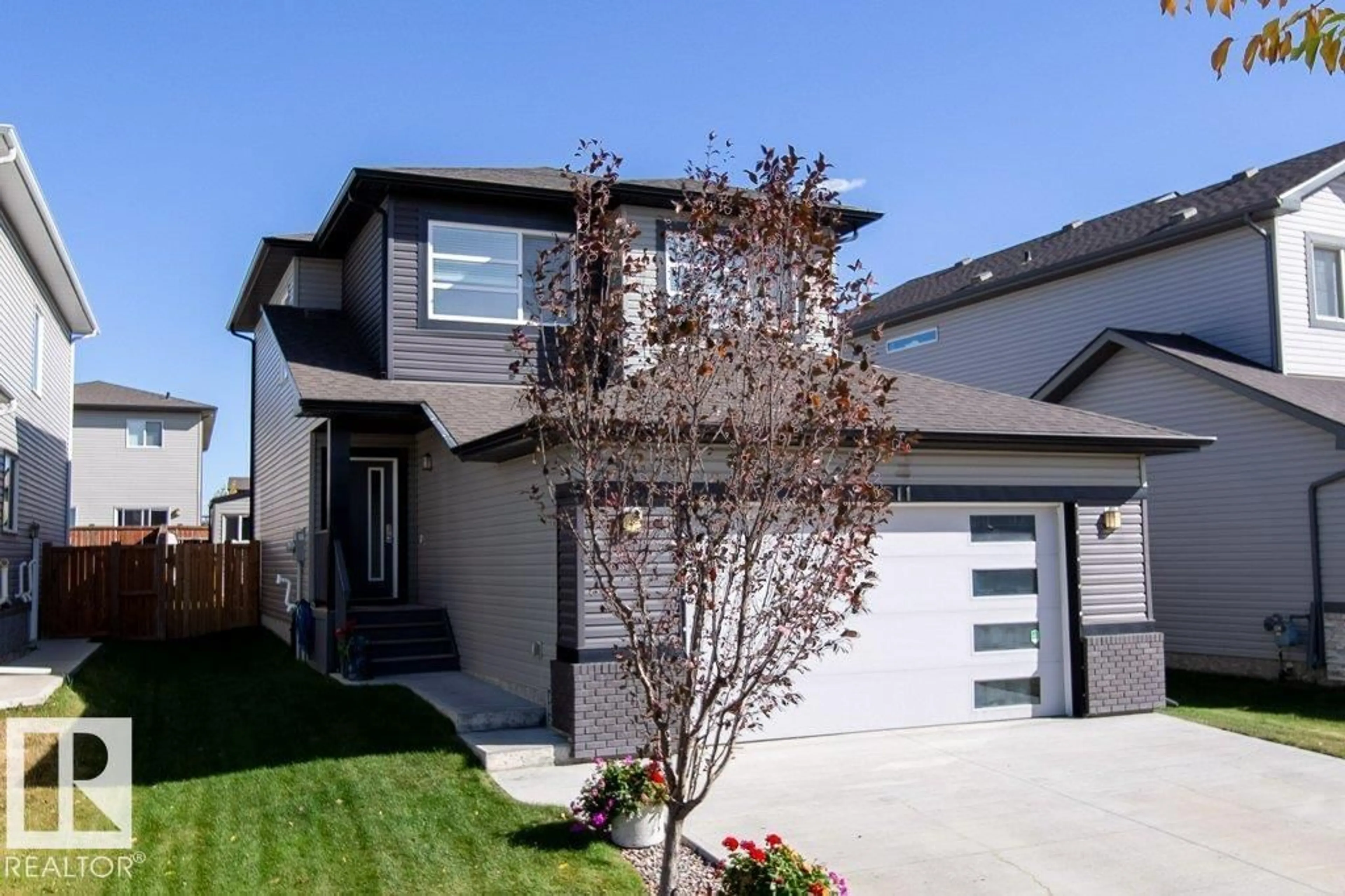 Home with vinyl exterior material, street for 4611 66 ST, Beaumont Alberta T4X2X5