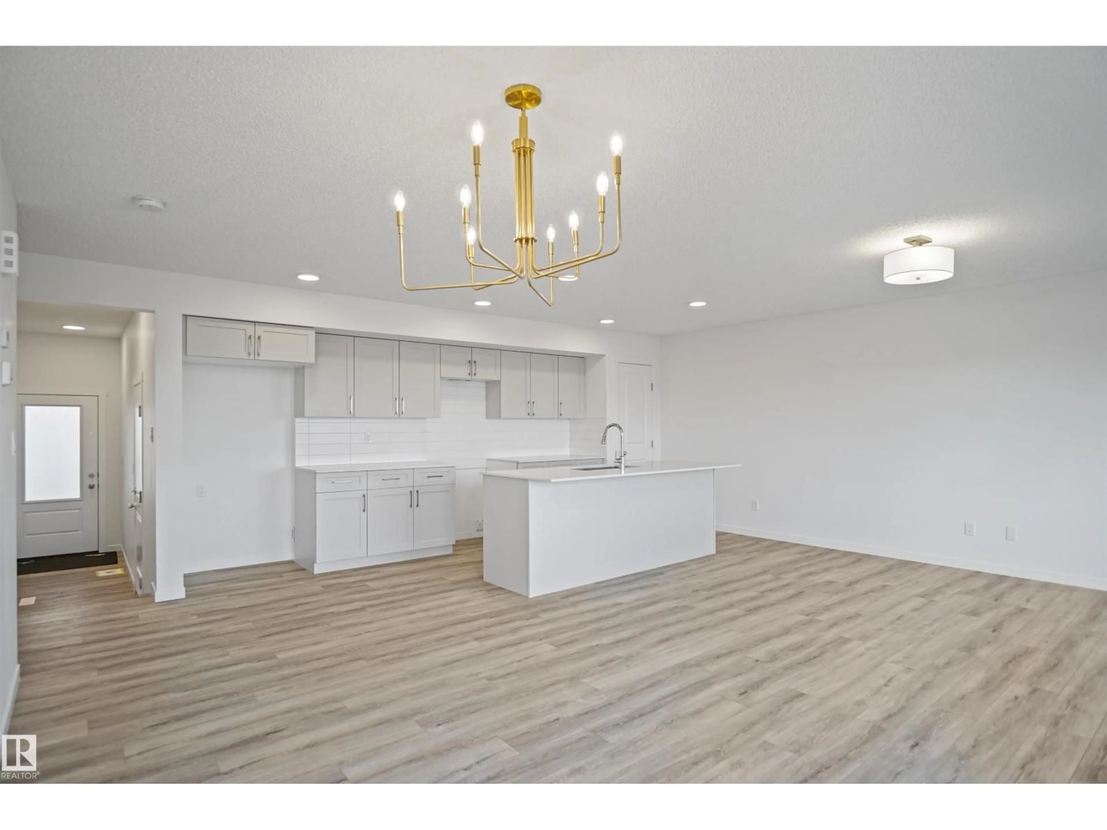 Open concept kitchen, wood/laminate floor for #17 - 19904 31 AV, Edmonton Alberta T6M1N7