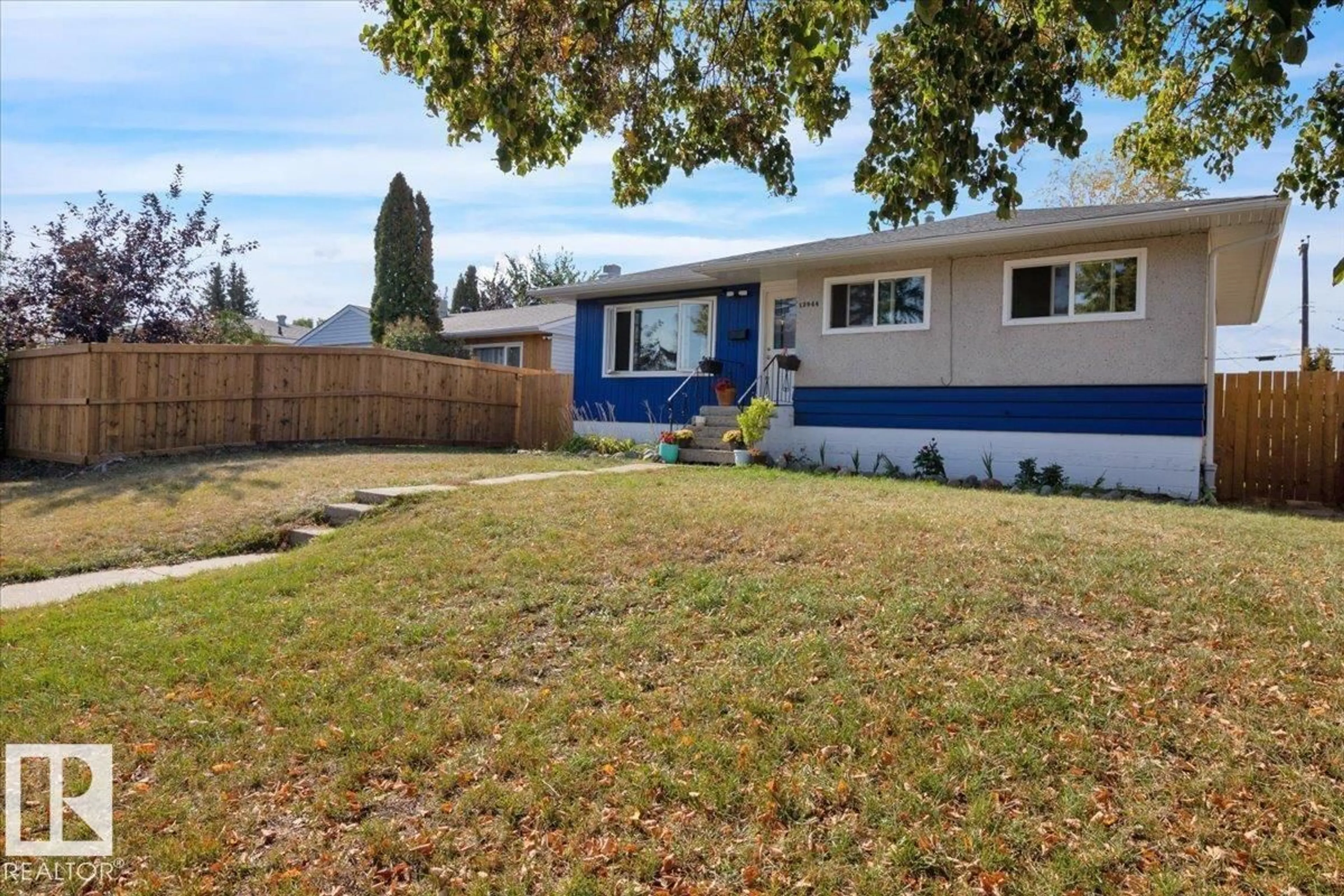 Home with vinyl exterior material, street for 12944 128 ST, Edmonton Alberta T5L1E5