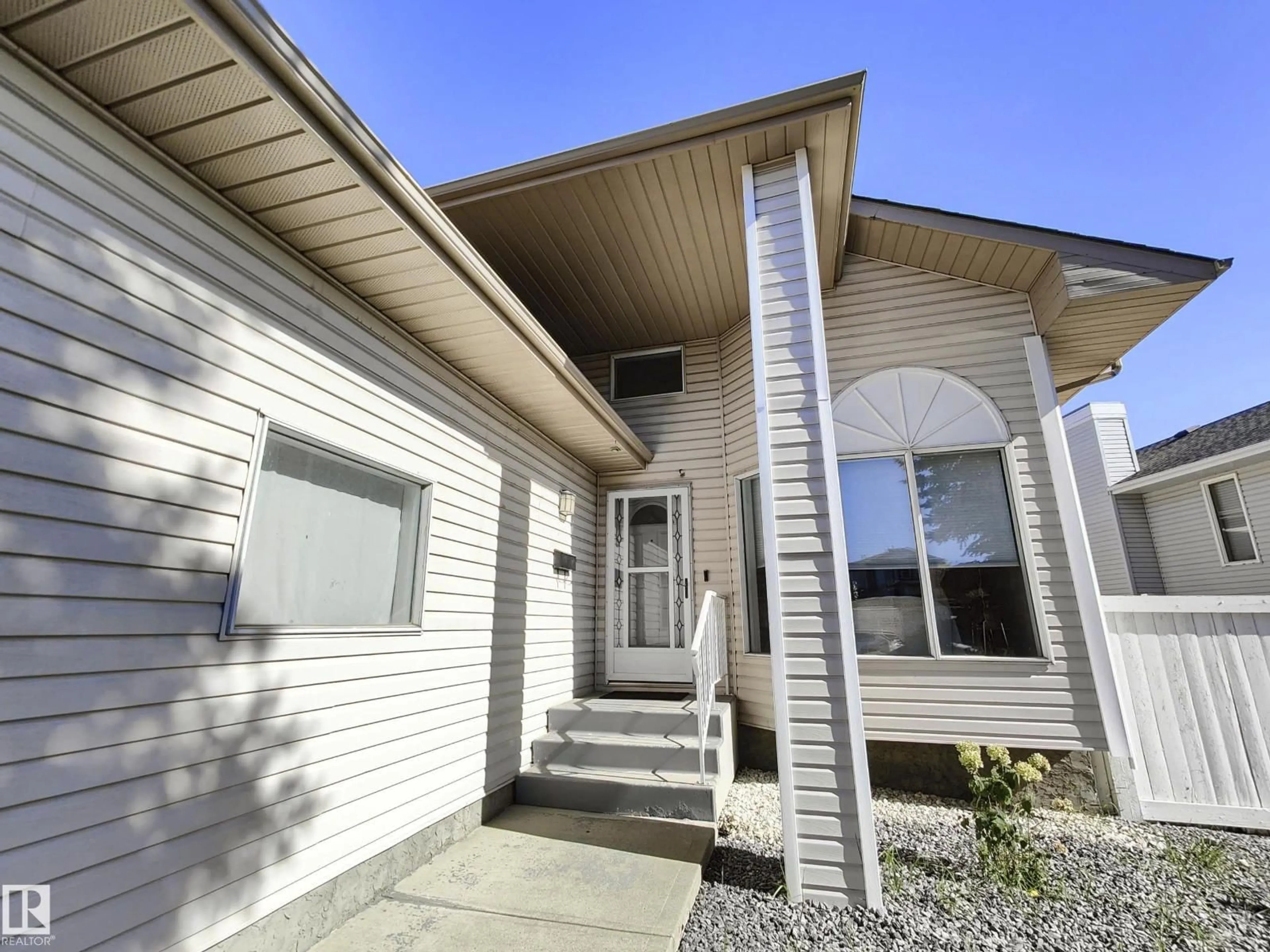 Home with vinyl exterior material, street for 215 PETER CL NW, Edmonton Alberta T5T5Y5