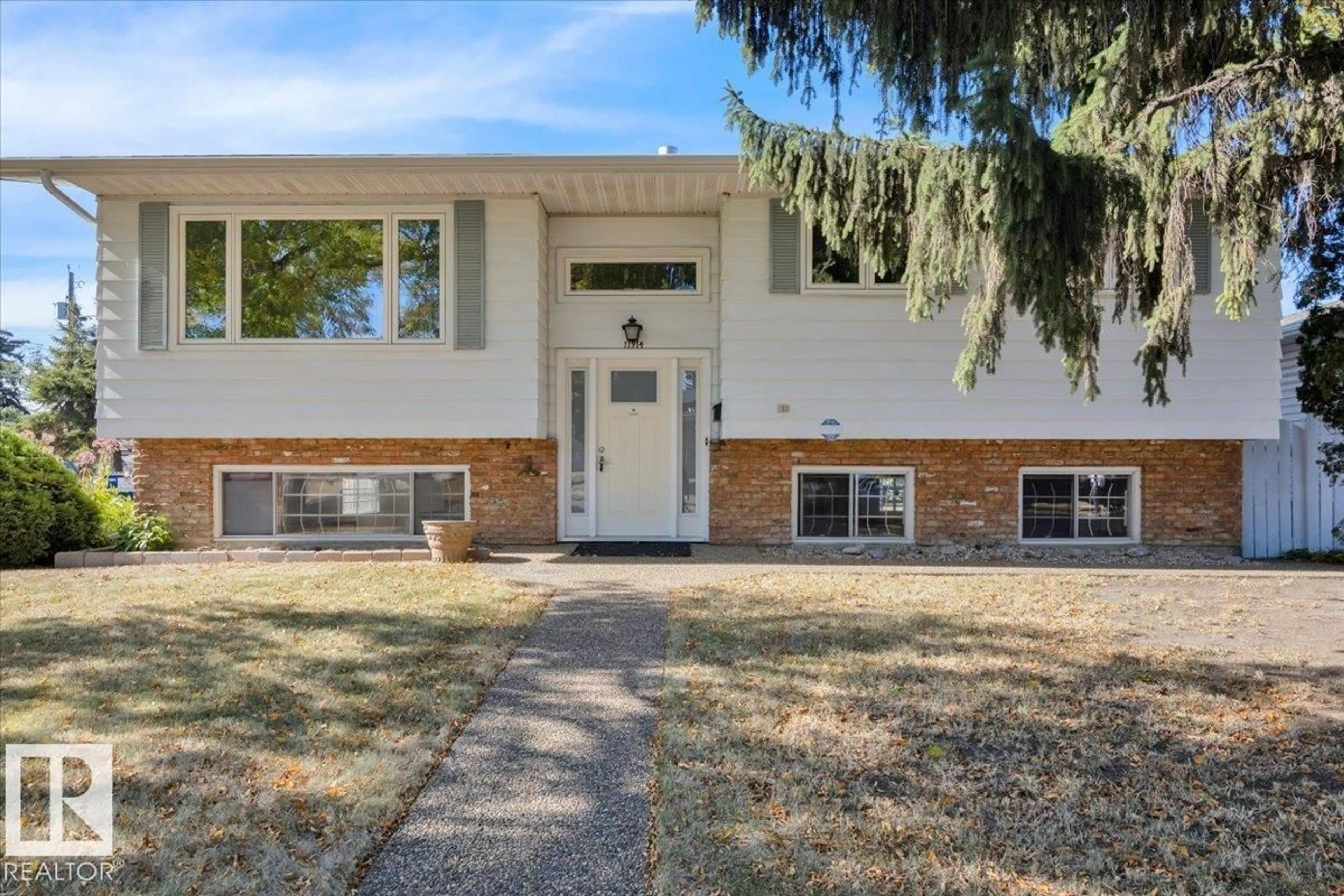 Home with brick exterior material, street for 11914 40 ST, Edmonton Alberta T5W2K9