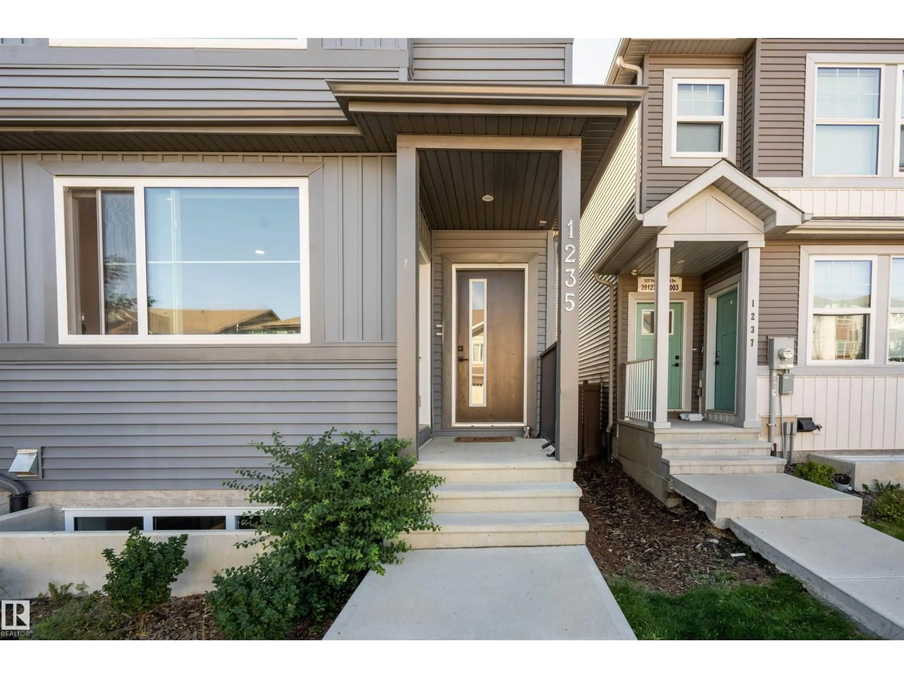 Home with vinyl exterior material, street for 1235 PODERSKY WD, Edmonton Alberta T6W4W3
