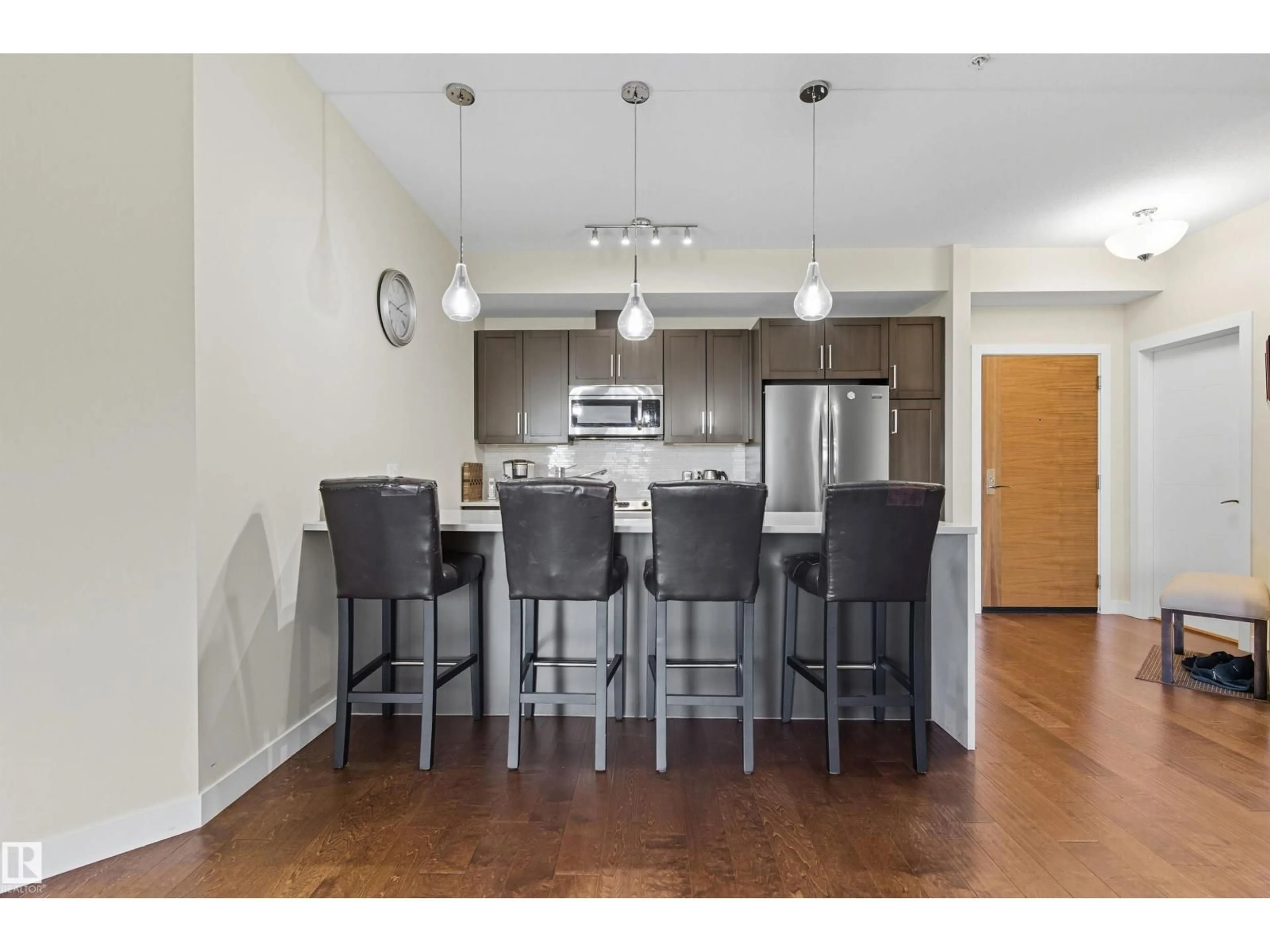 Open concept kitchen, wood/laminate floor for #414 - 625 LEGER WY, Edmonton Alberta T6R0W4