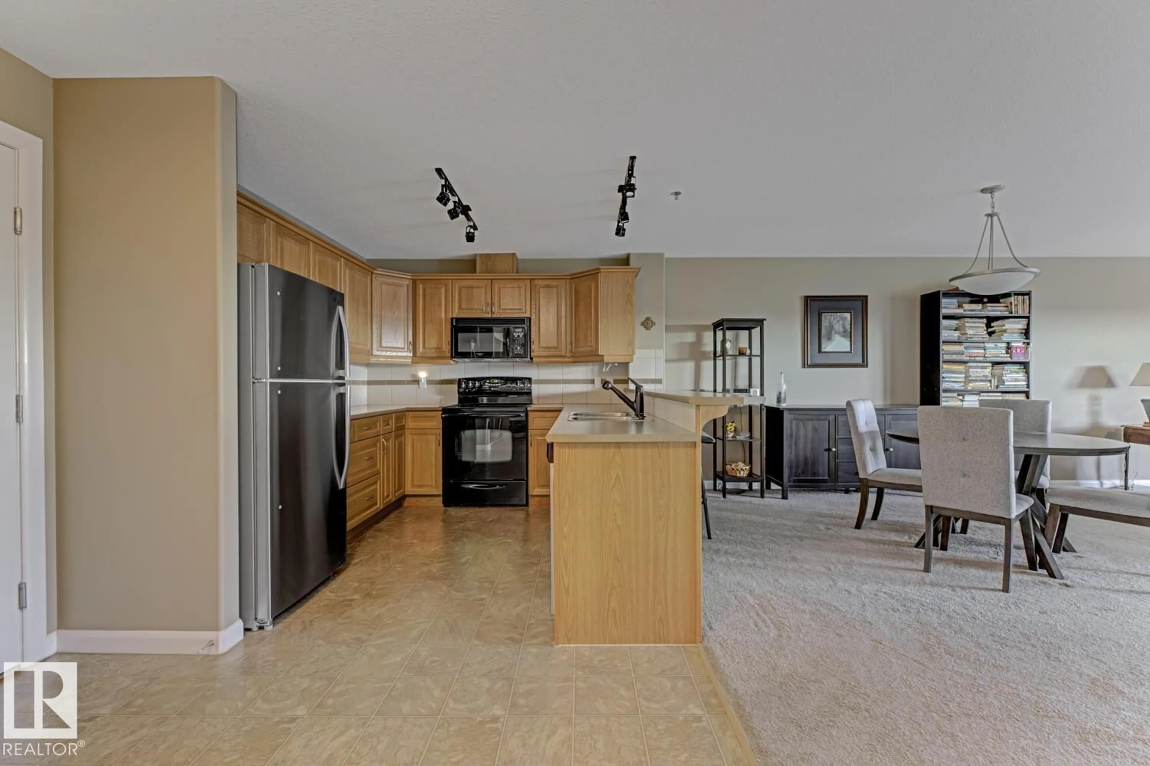 Open concept kitchen, ceramic/tile floor for #310 - 530 HOOKE RD, Edmonton Alberta T5A5J5