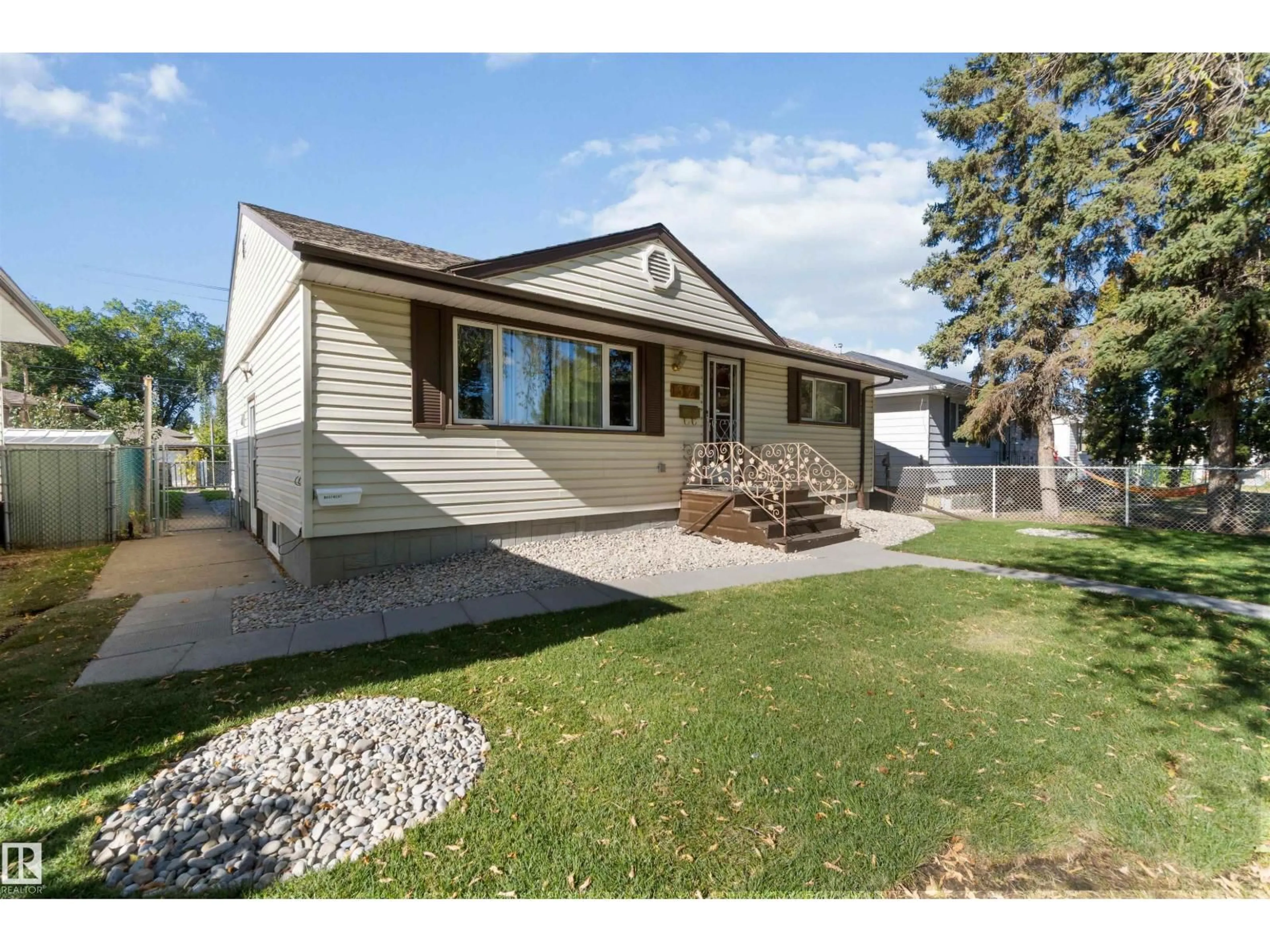 Home with vinyl exterior material, street for NW - 13124 63 ST, Edmonton Alberta T5A0W8