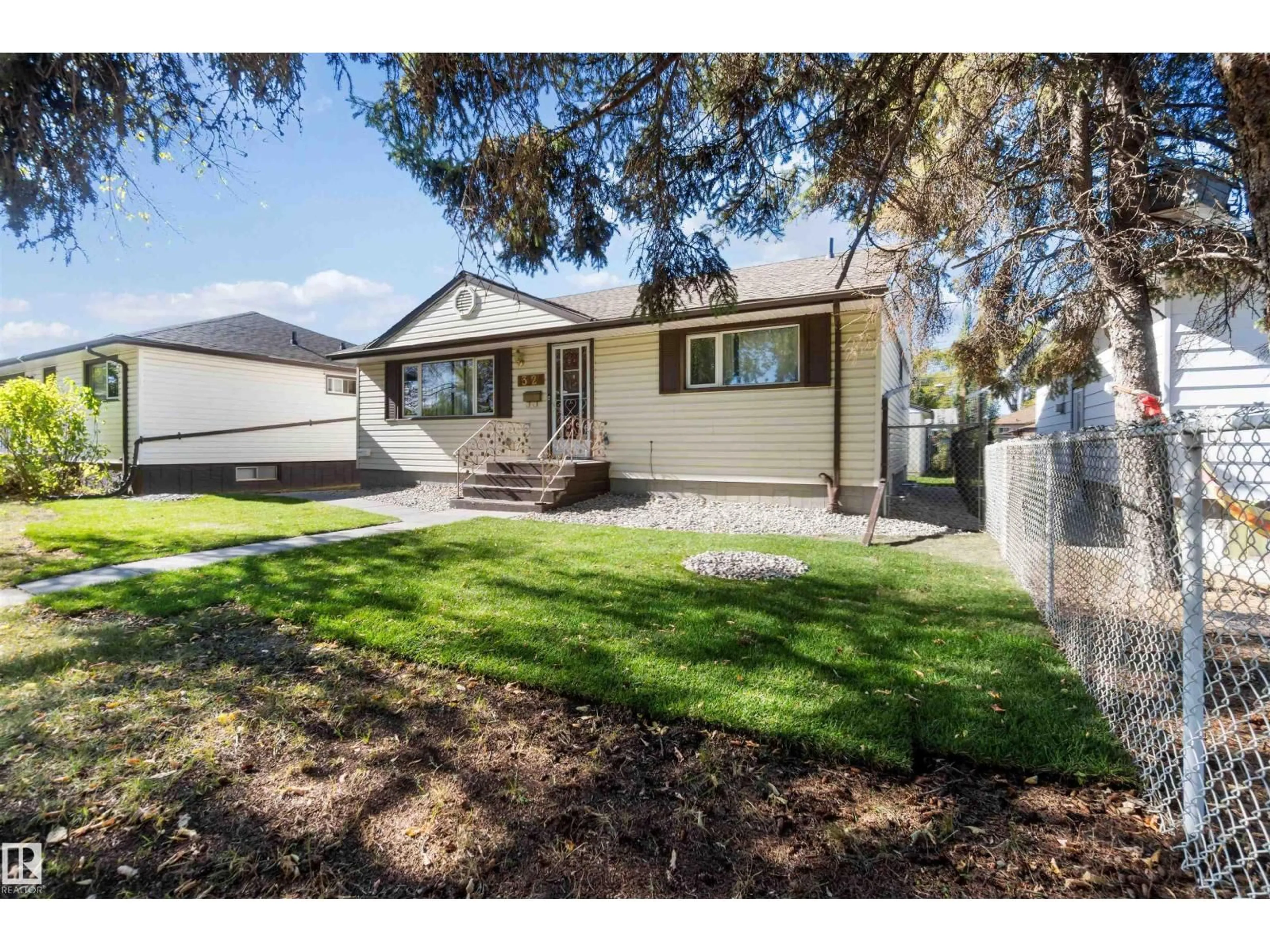 Home with vinyl exterior material, street for NW - 13124 63 ST, Edmonton Alberta T5A0W8
