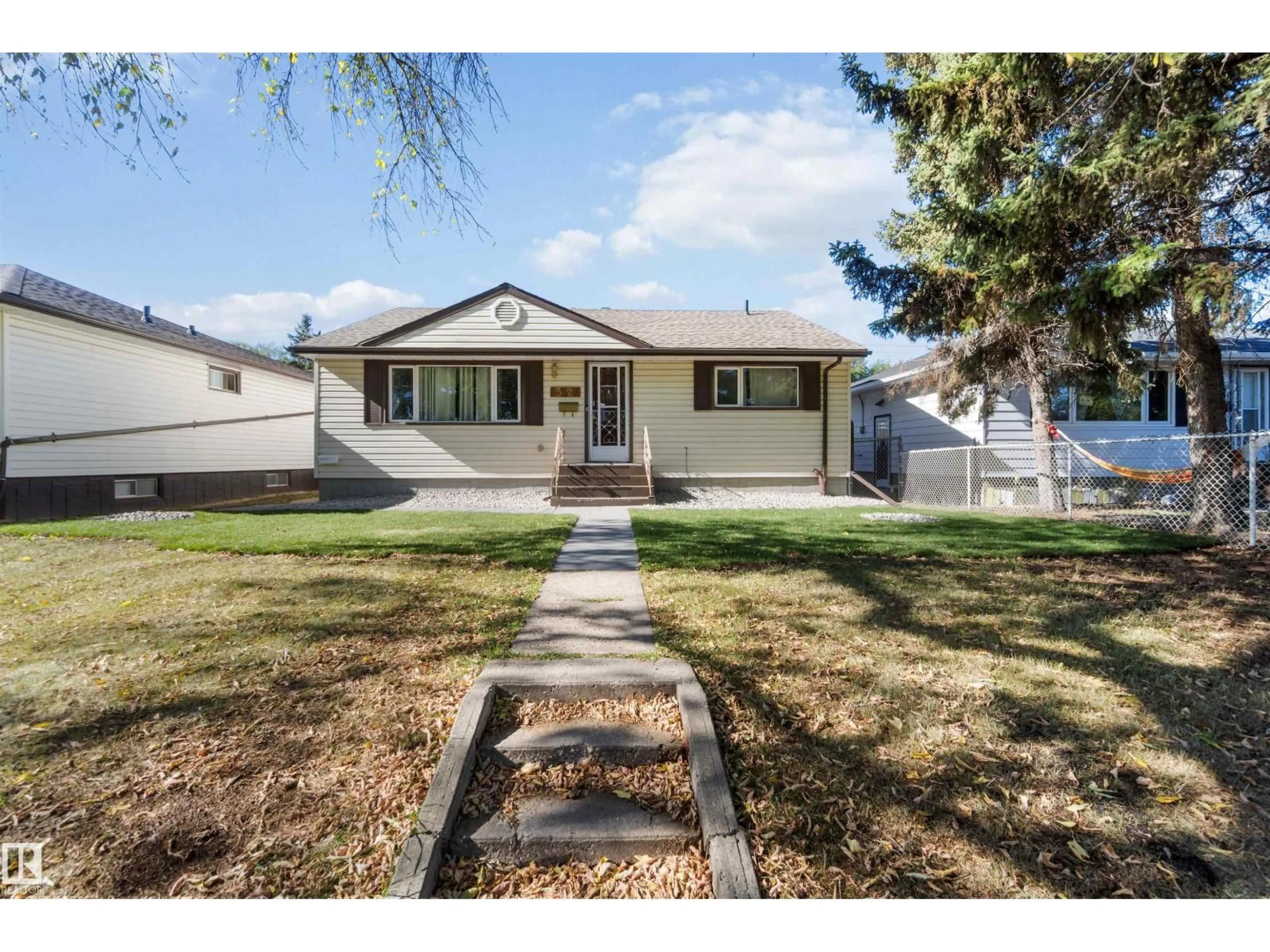 Home with vinyl exterior material, street for NW - 13124 63 ST, Edmonton Alberta T5A0W8