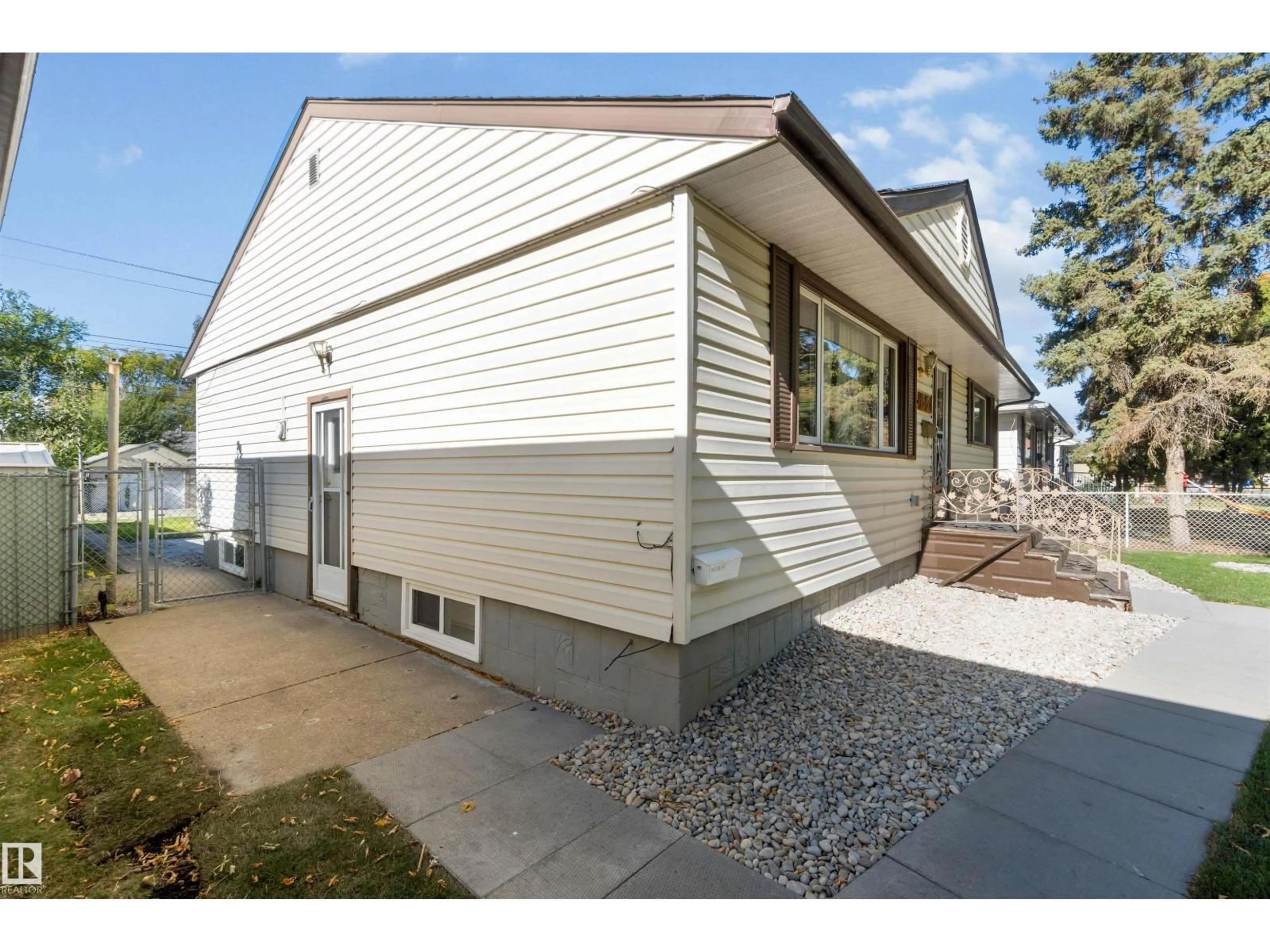 Home with vinyl exterior material, street for NW - 13124 63 ST, Edmonton Alberta T5A0W8