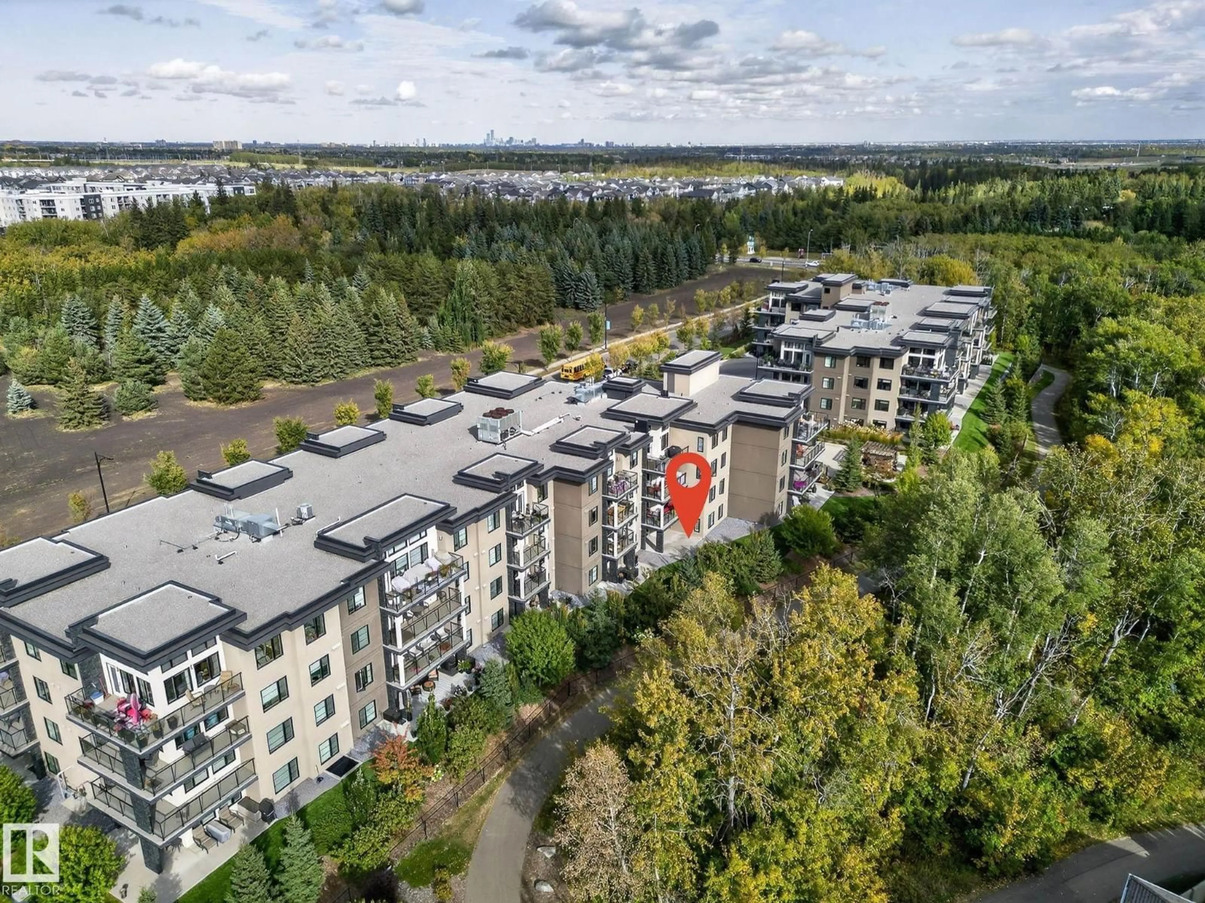 A pic from outside/outdoor area/front of a property/back of a property/a pic from drone, unknown for #102 - 5029 EDGEMONT BV, Edmonton Alberta T6M0S8