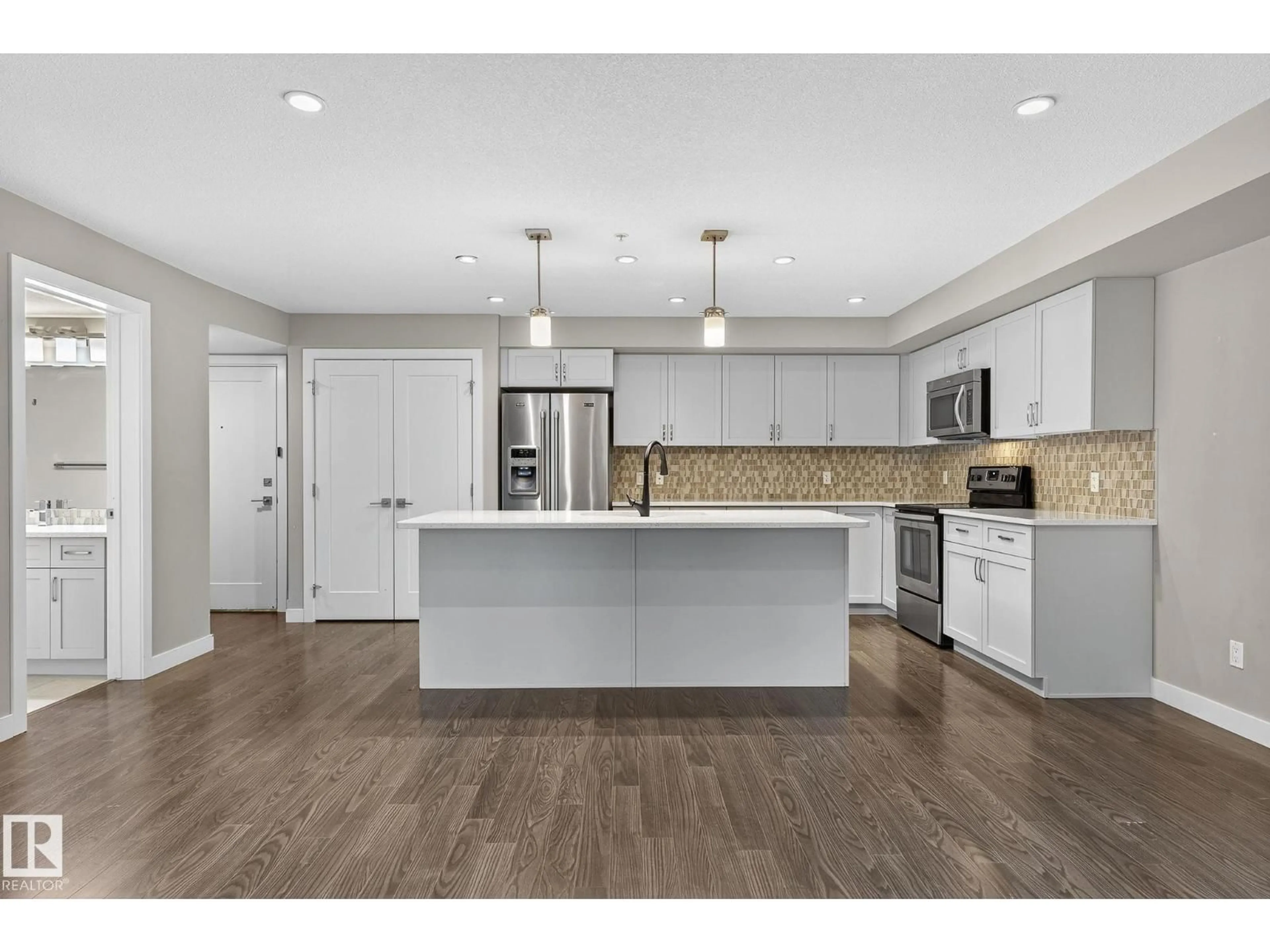 Open concept kitchen, unknown for #102 - 5029 EDGEMONT BV, Edmonton Alberta T6M0S8