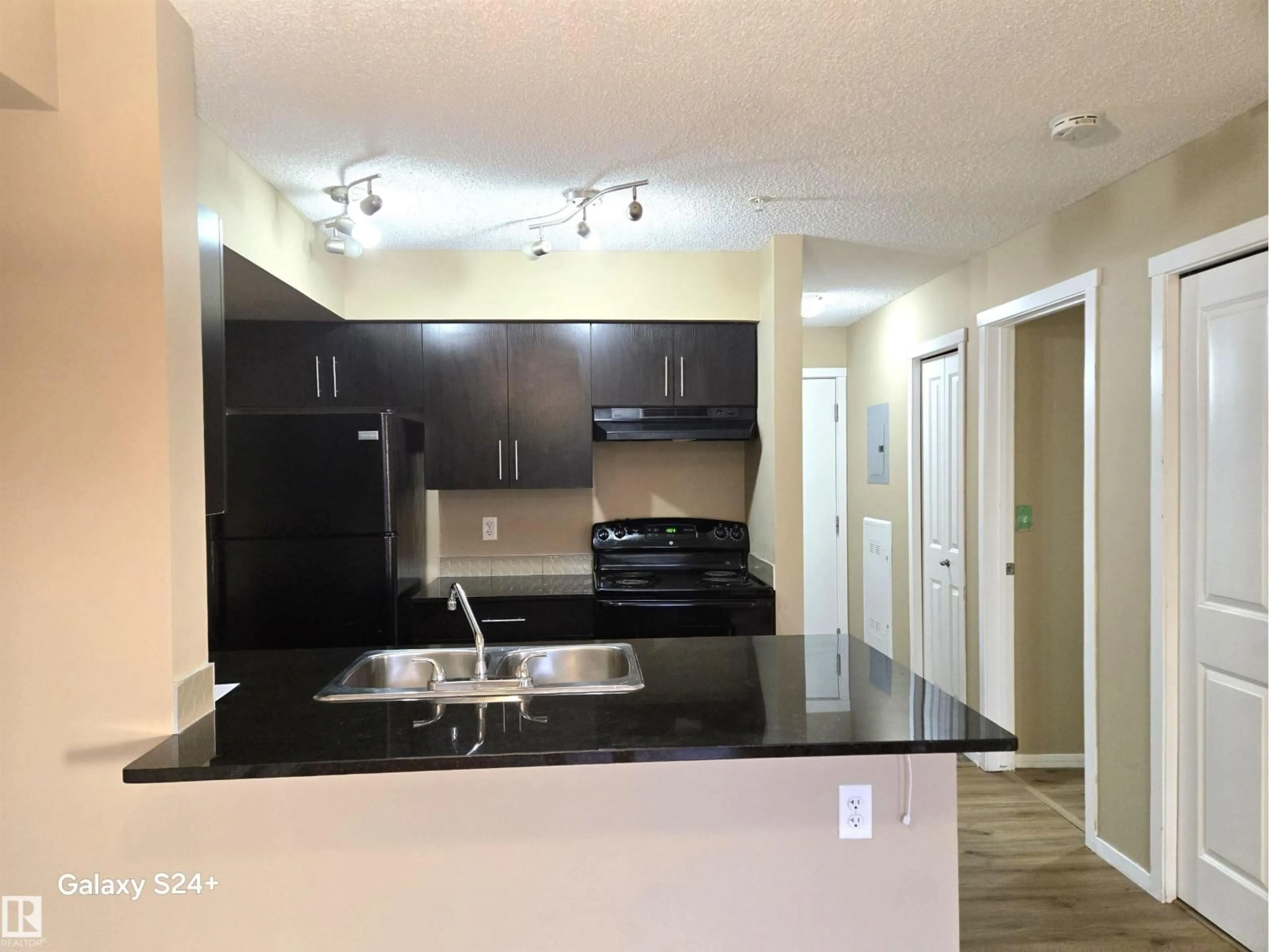 Open concept kitchen, unknown for 210 - 3207 JAMES MOWATT TR, Edmonton Alberta T6W3L6