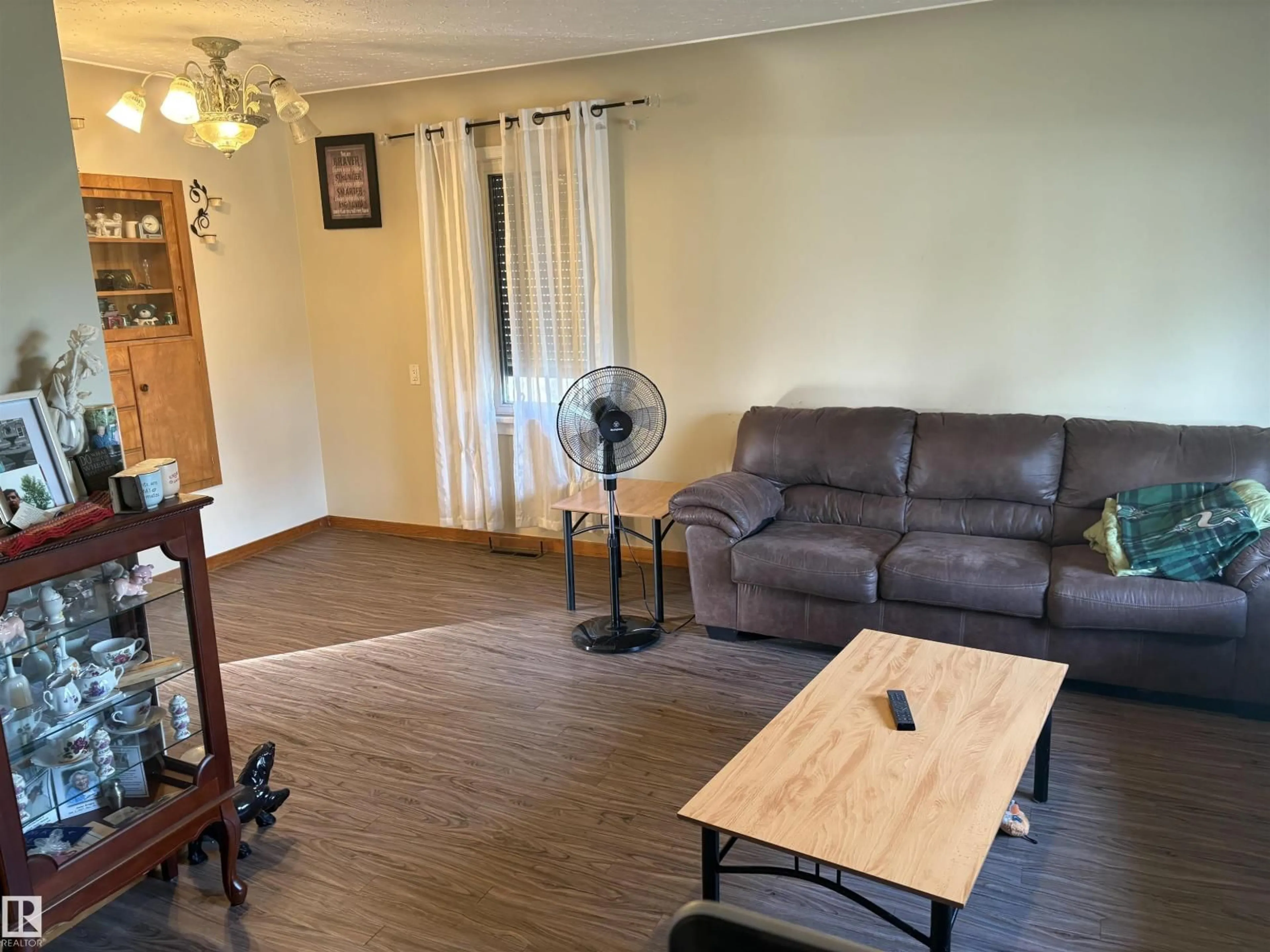 Living room with furniture, wood/laminate floor for 4840 50 ST, Gibbons Alberta T0A1N0