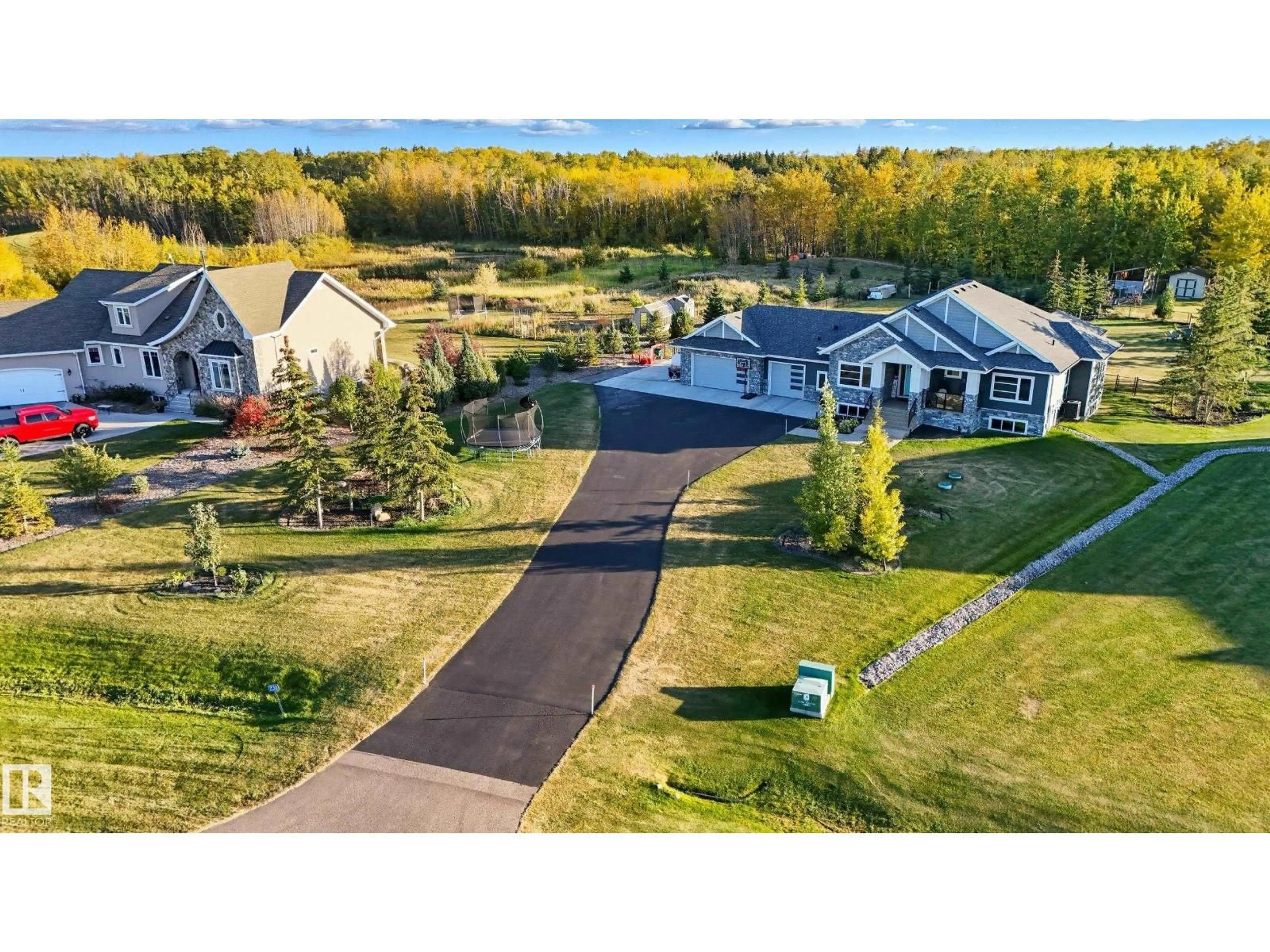 A pic from outside/outdoor area/front of a property/back of a property/a pic from drone, unknown for 230 50516 RANGE ROAD, Rural Leduc County Alberta T4X0L4