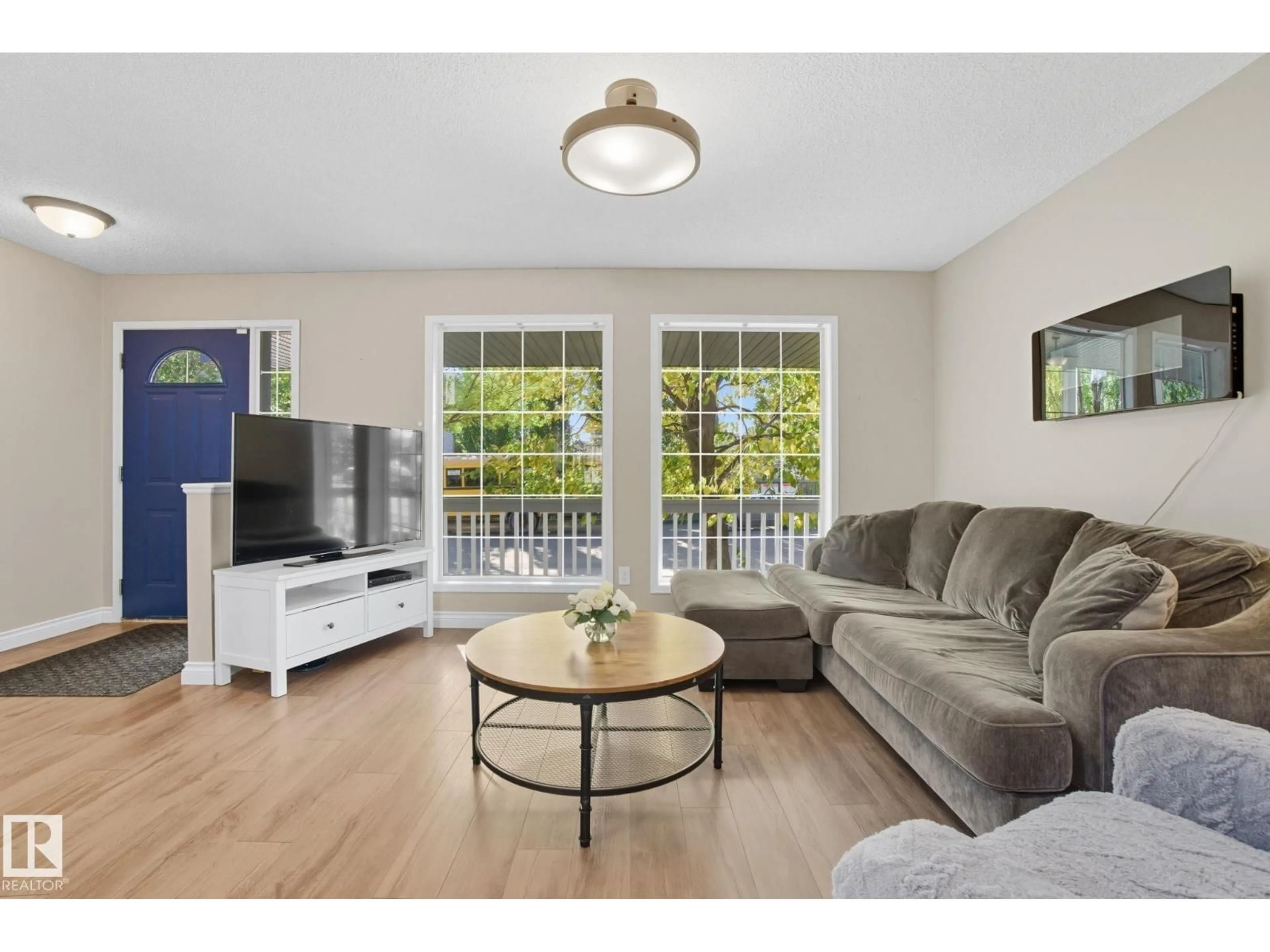 Living room with furniture, wood/laminate floor for 1438 GRANT WY, Edmonton Alberta T5T6L3