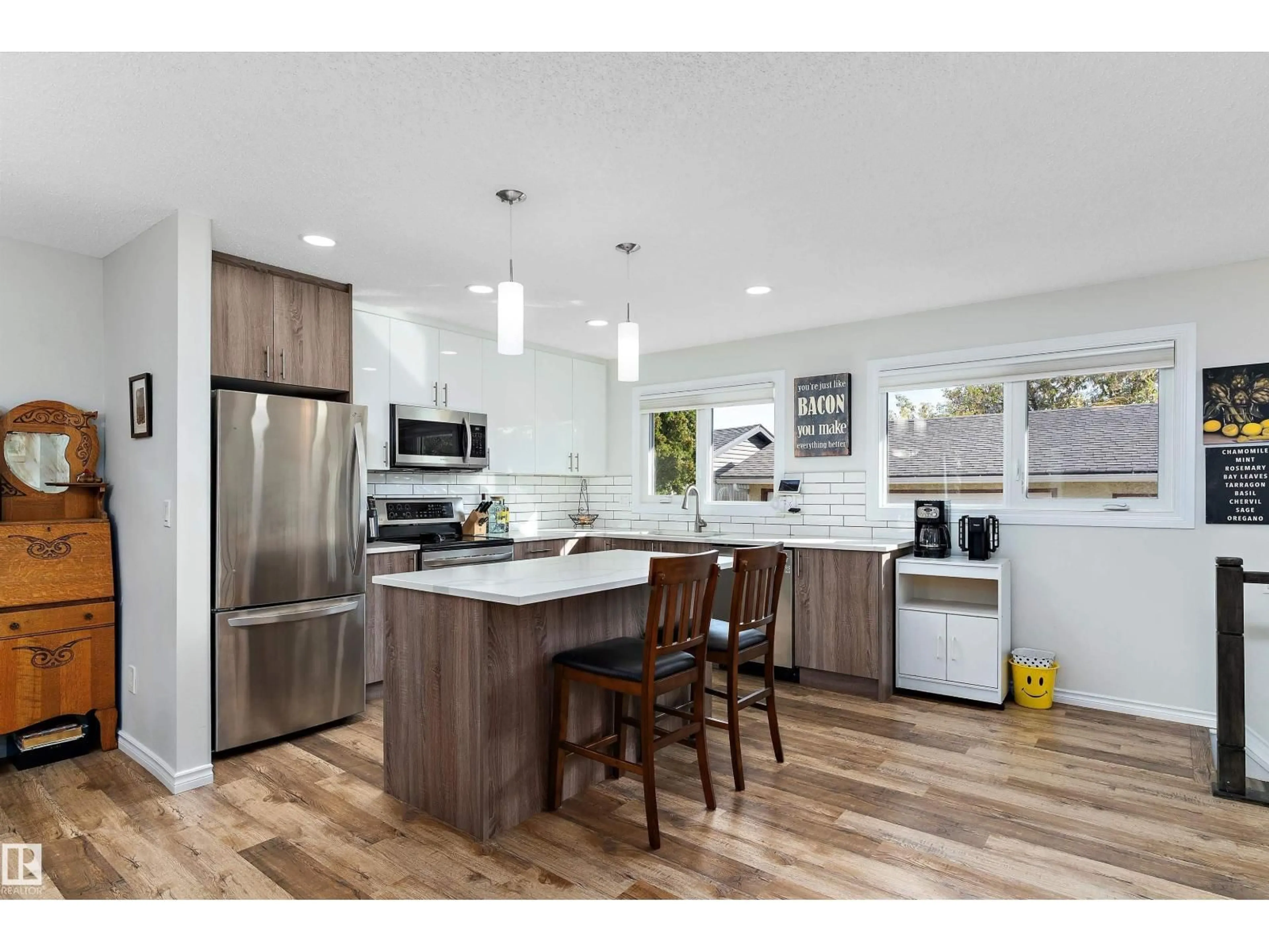 Open concept kitchen, wood/laminate floor for NW - 6703 182 ST, Edmonton Alberta T5T2C3