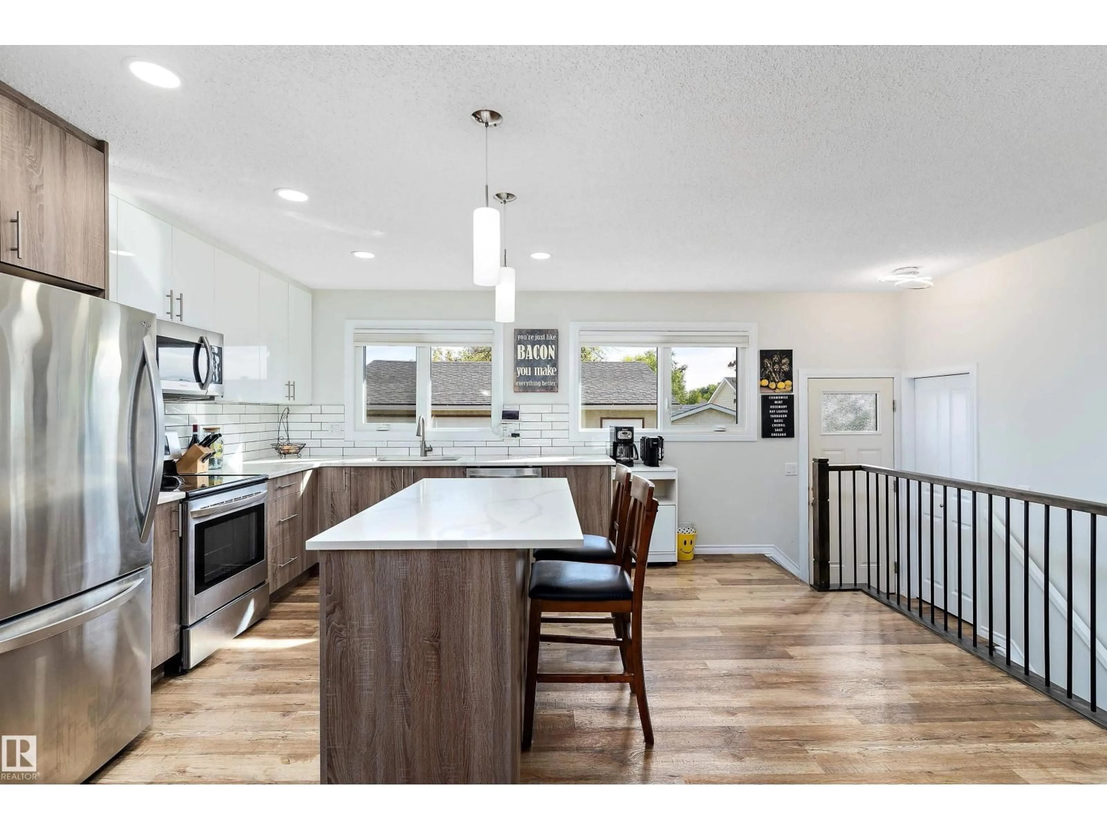 Open concept kitchen, wood/laminate floor for NW - 6703 182 ST, Edmonton Alberta T5T2C3