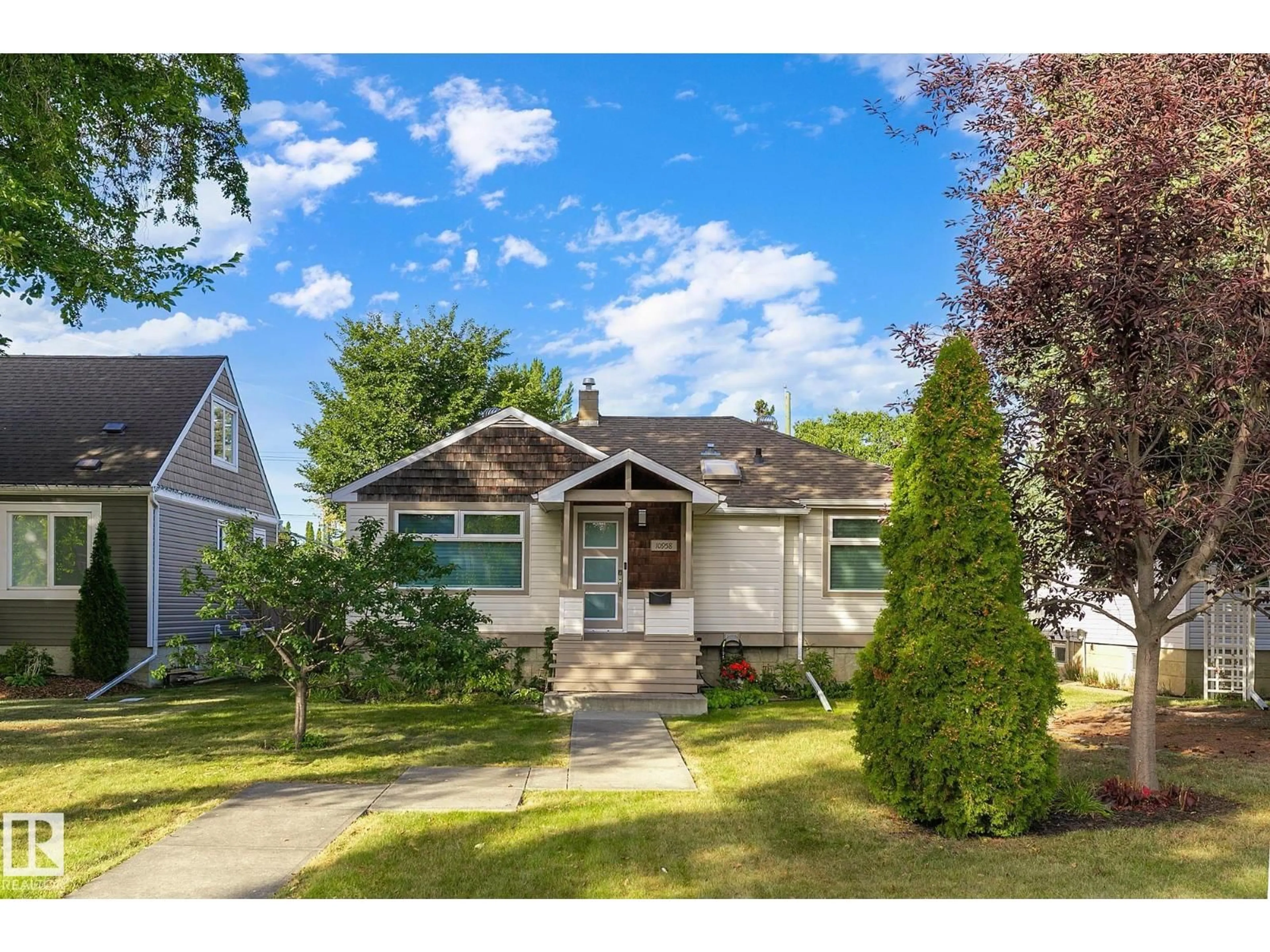Home with vinyl exterior material, street for NW - 10958 117 ST, Edmonton Alberta T5H3N6