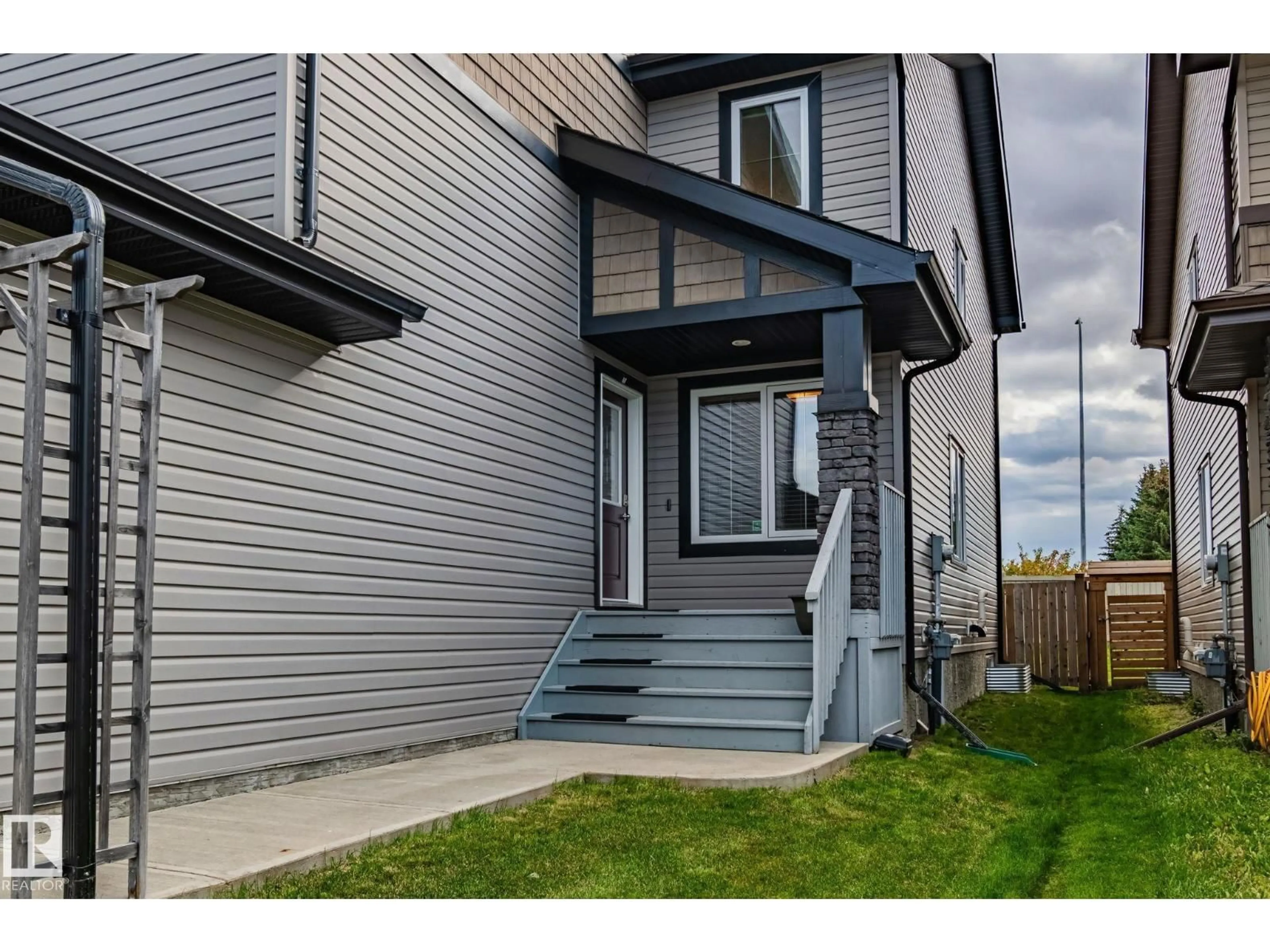 Home with vinyl exterior material, street for 7159 CARDINAL WY, Edmonton Alberta T5W2Y3