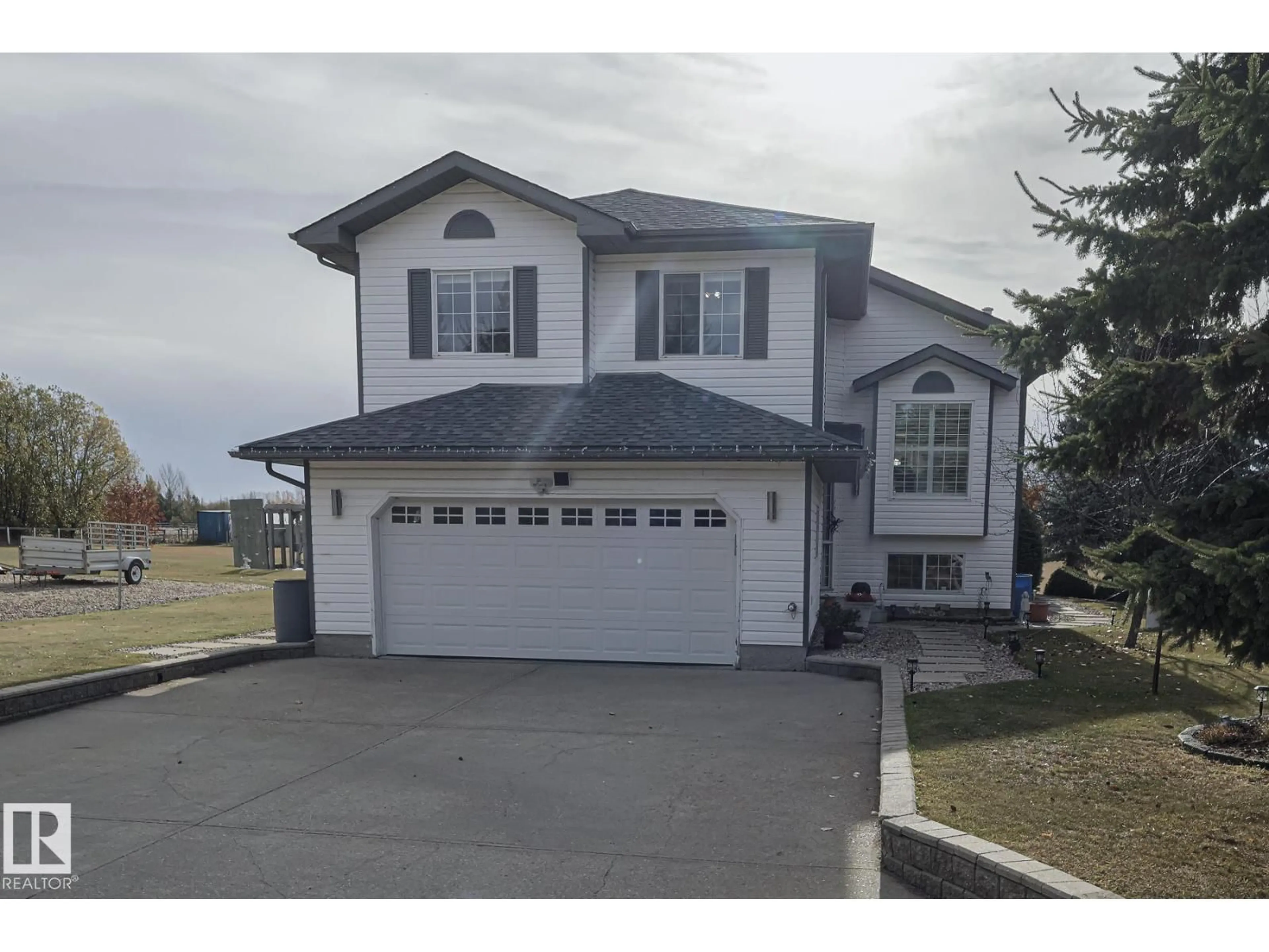 Home with vinyl exterior material, street for 56220 - 38 RGE ROAD 230, Rural Sturgeon County Alberta T0A1N0