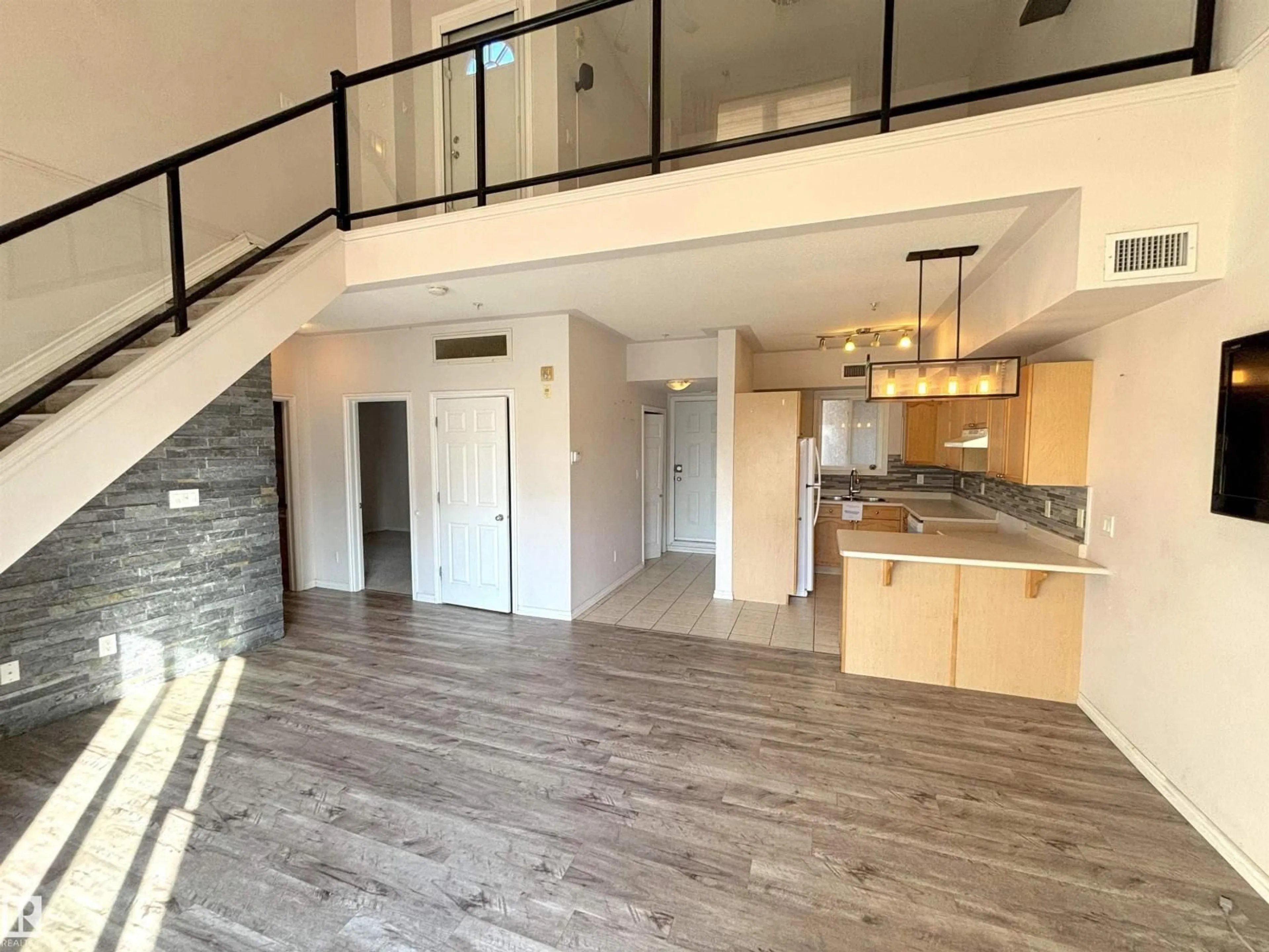 Open concept kitchen, wood/laminate floor for #510 - 10606 102 AV, Edmonton Alberta T5J5E9