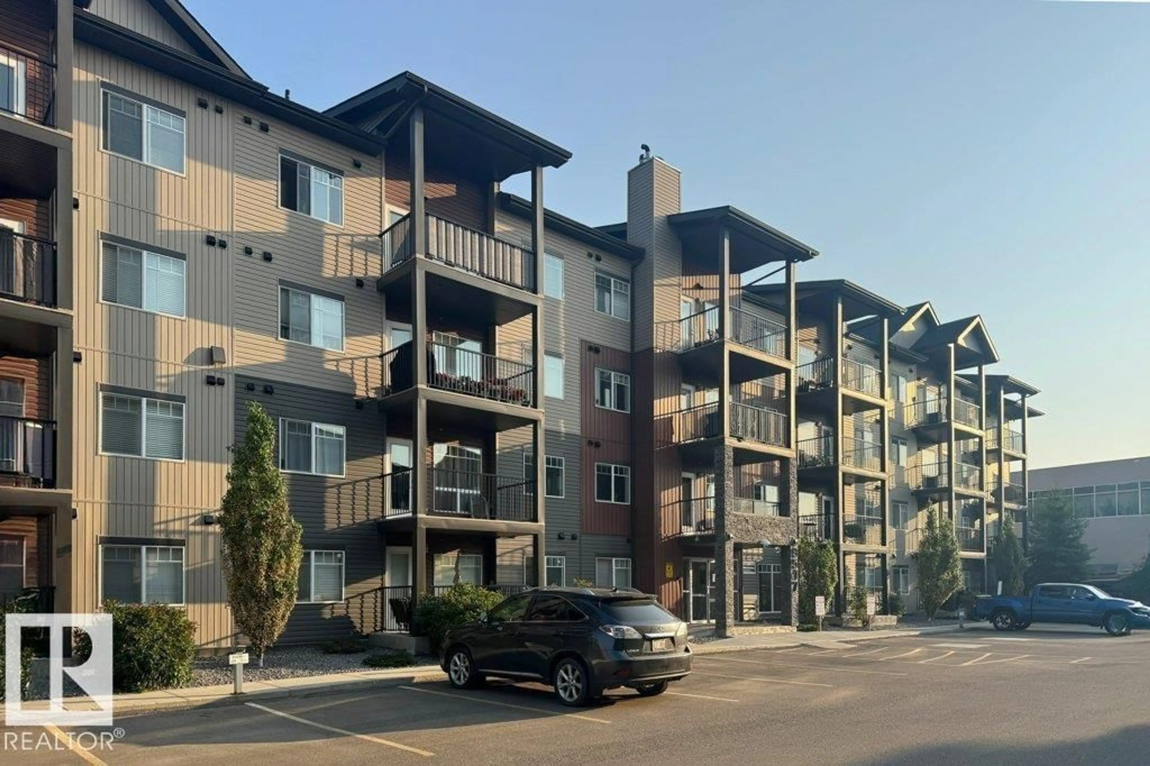 A pic from outside/outdoor area/front of a property/back of a property/a pic from drone, street for #212 - 9517 160 AV, Edmonton Alberta T5Z0N1