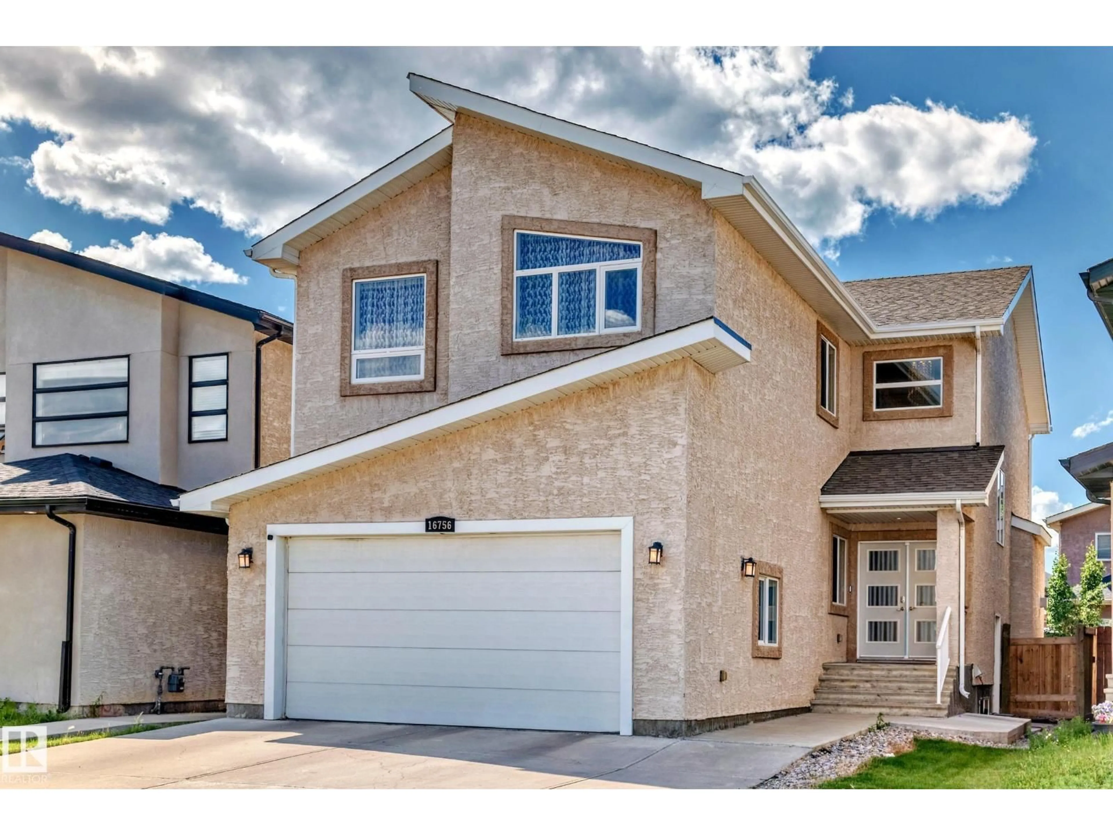 Home with vinyl exterior material, street for 16756 61 ST, Edmonton Alberta T5Y0W7