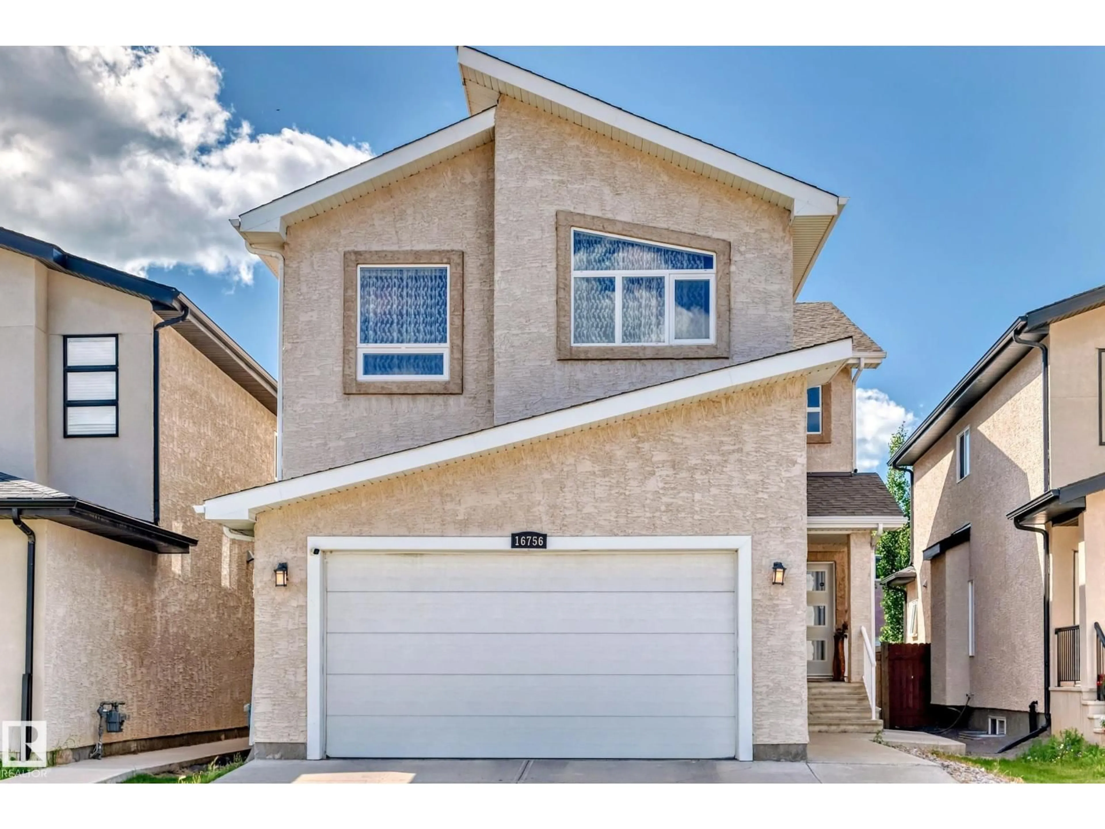 Home with vinyl exterior material, street for 16756 61 ST, Edmonton Alberta T5Y0W7