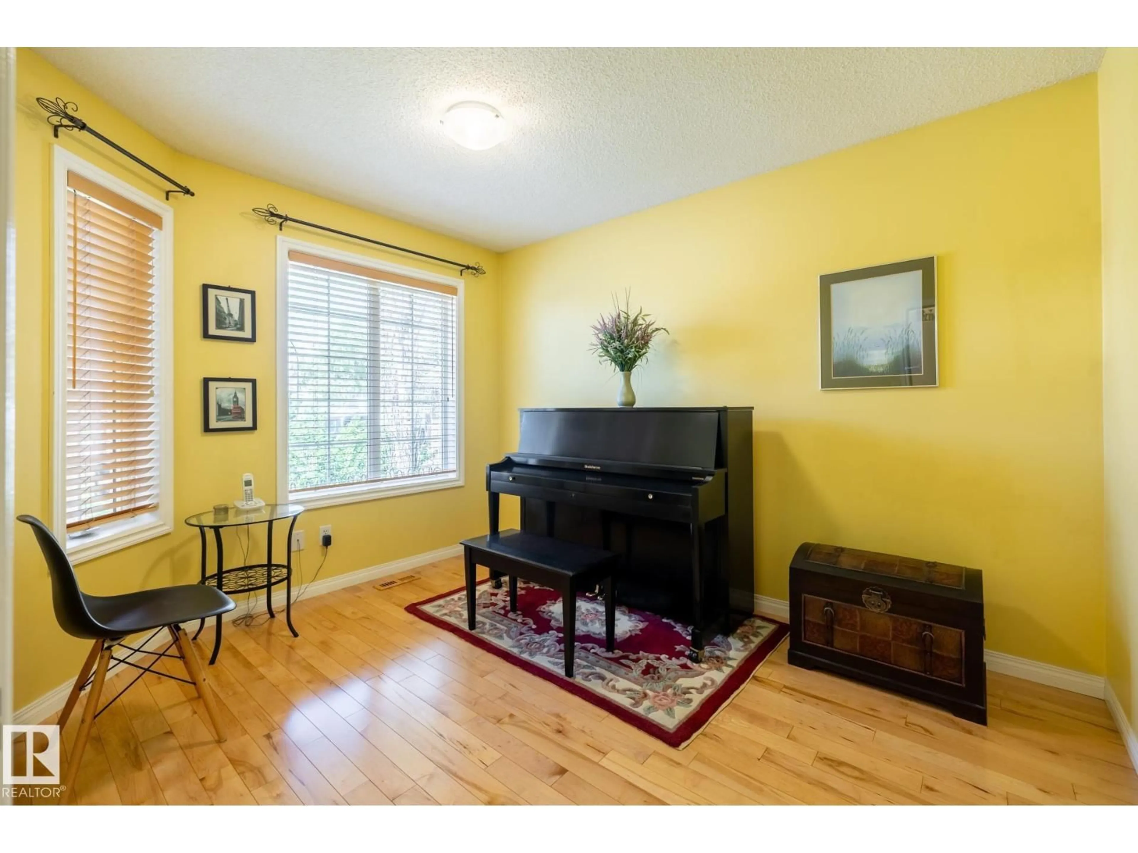 Living room with furniture, wood/laminate floor for 357 BLACKBURN DR, Edmonton Alberta T6W1B8