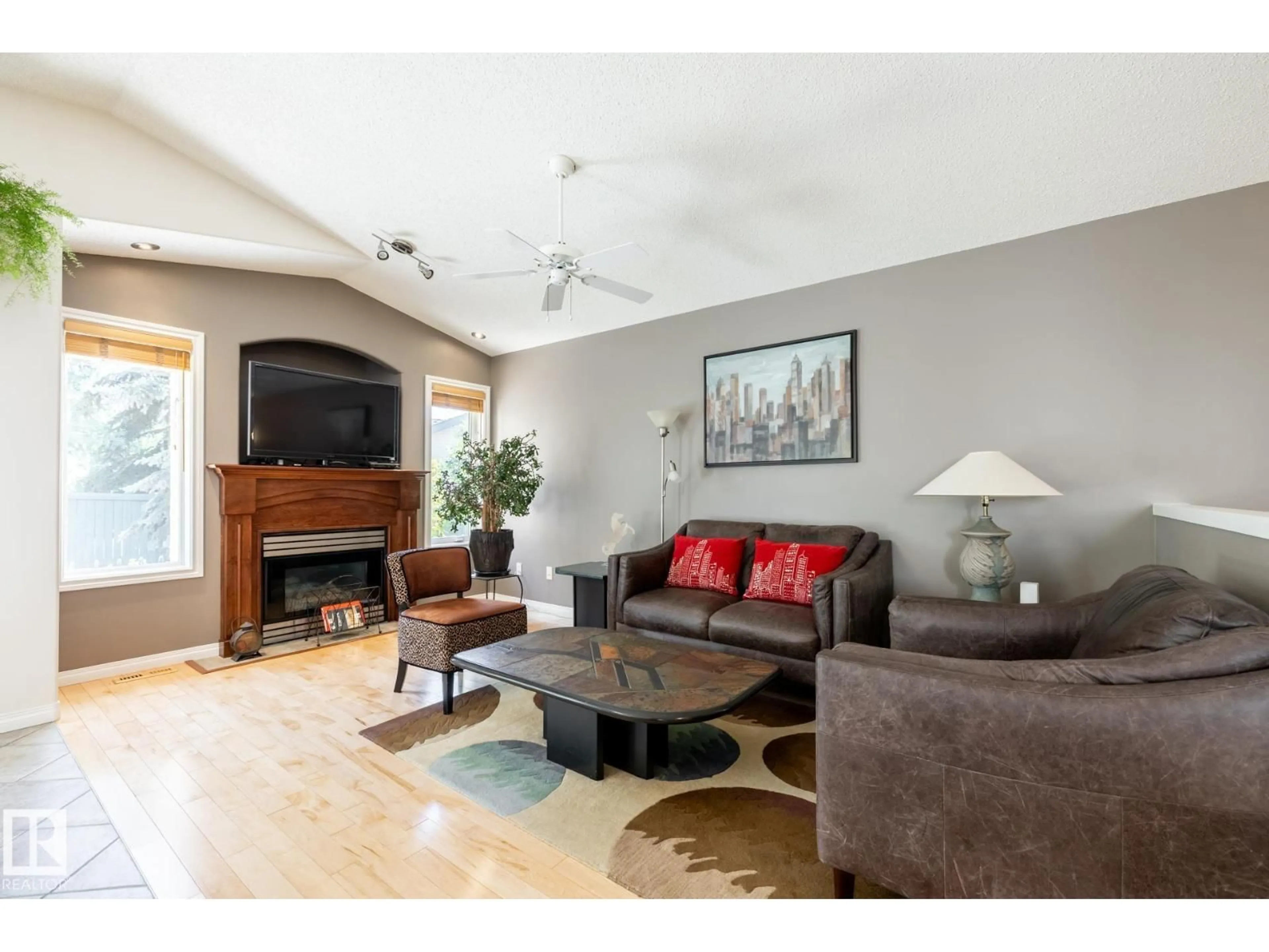 Living room with furniture, wood/laminate floor for 357 BLACKBURN DR, Edmonton Alberta T6W1B8