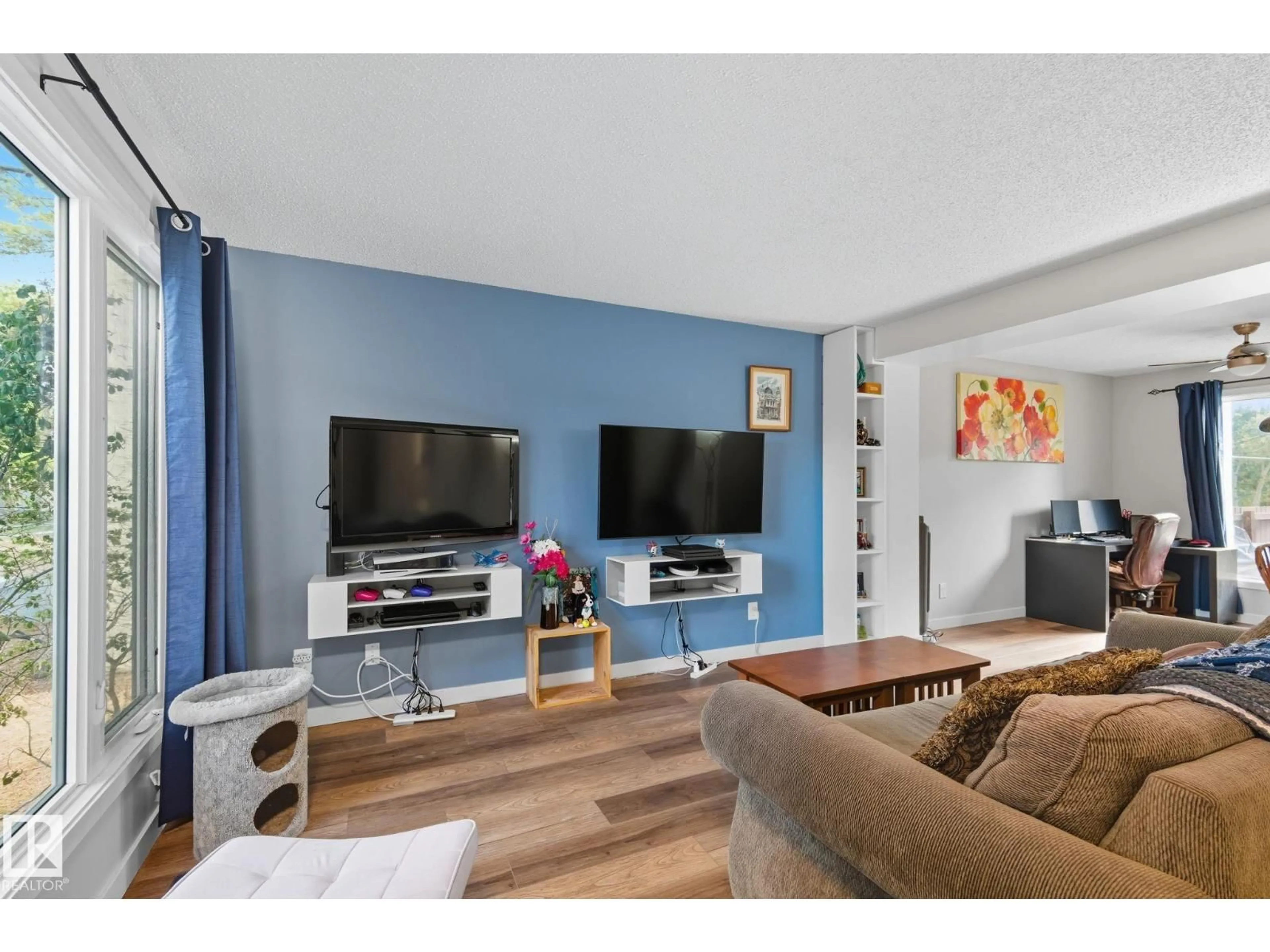 Living room with furniture, wood/laminate floor for 12047 162 AV, Edmonton Alberta T5X3R1