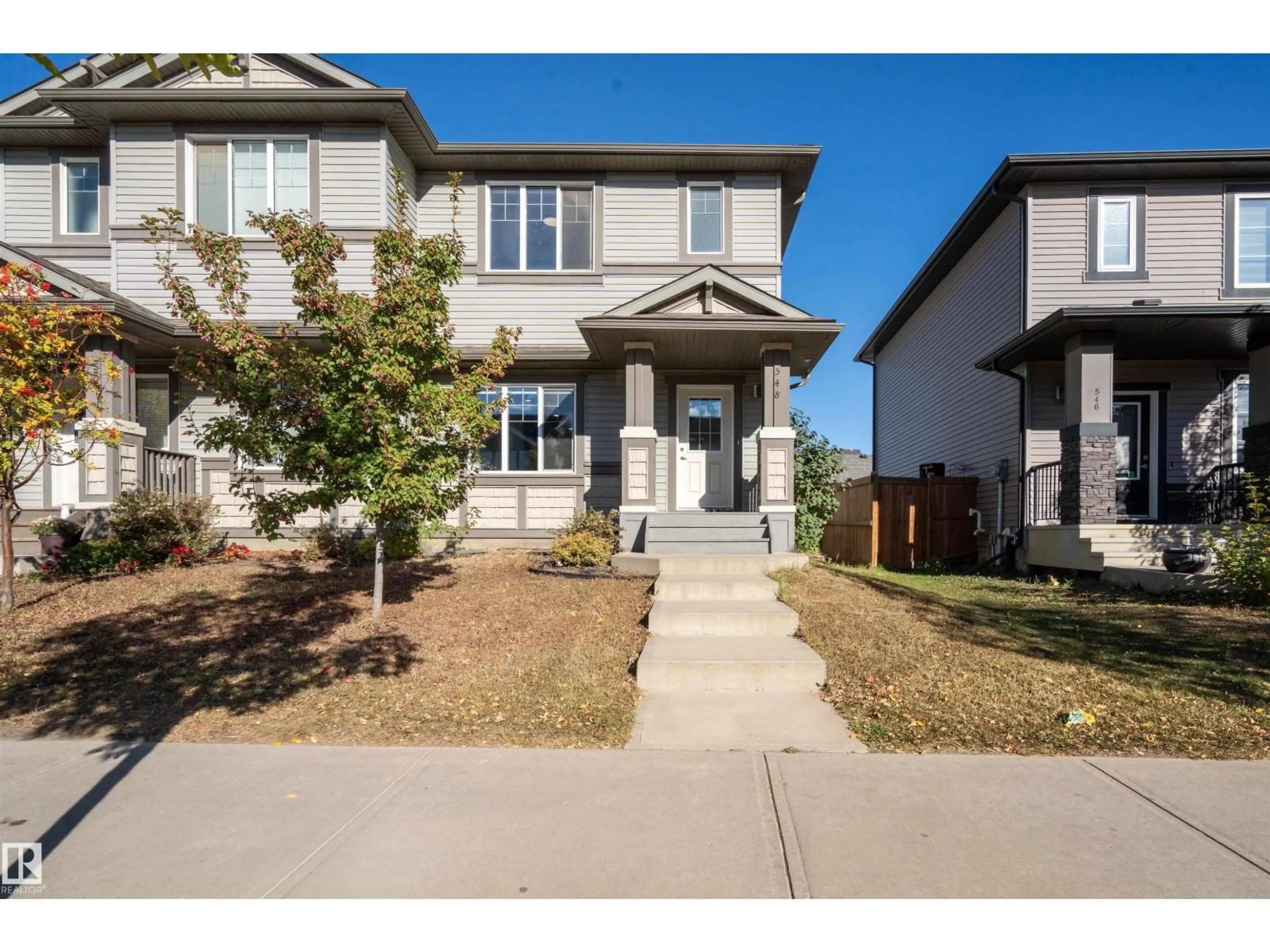 Home with vinyl exterior material, street for 548 SECORD BV, Edmonton Alberta T5T7B8