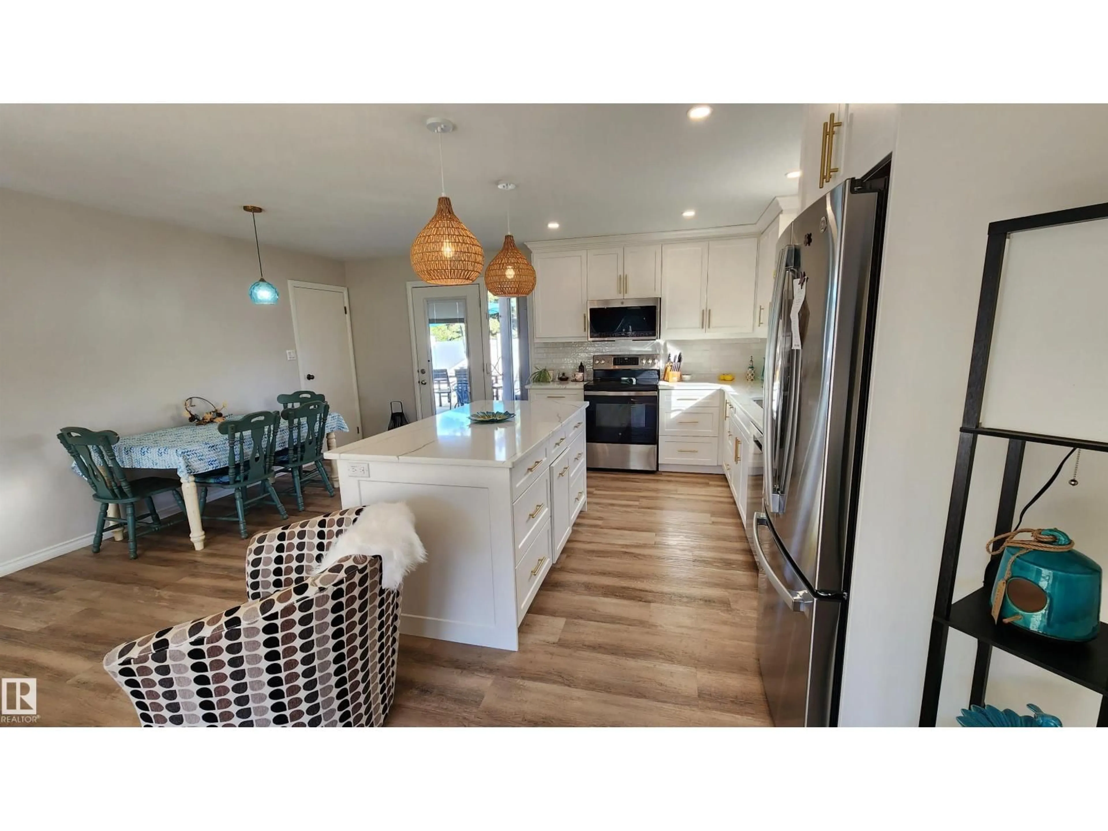 Open concept kitchen, wood/laminate floor for 5406 CIRCLE DR, Elk Point Alberta T0A1A0