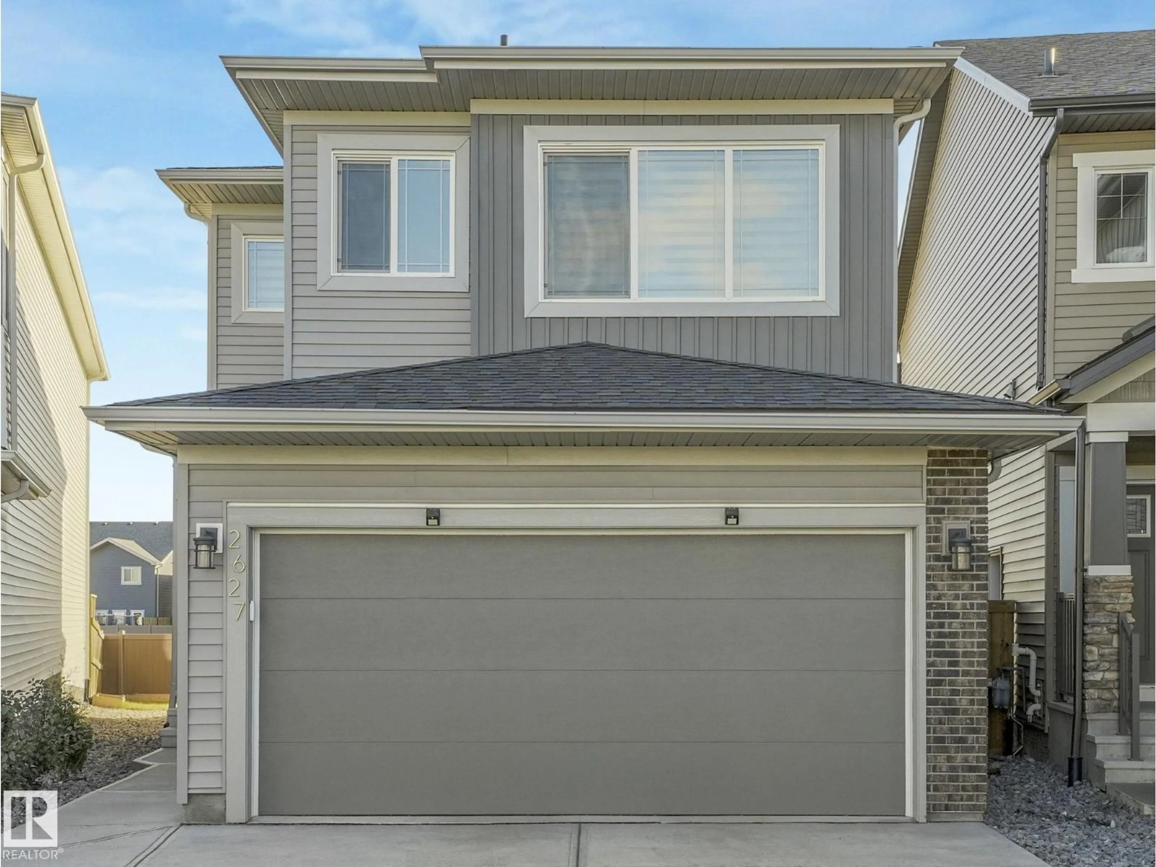 Home with vinyl exterior material, street for NW - 2627 200 ST, Edmonton Alberta T6M1K3
