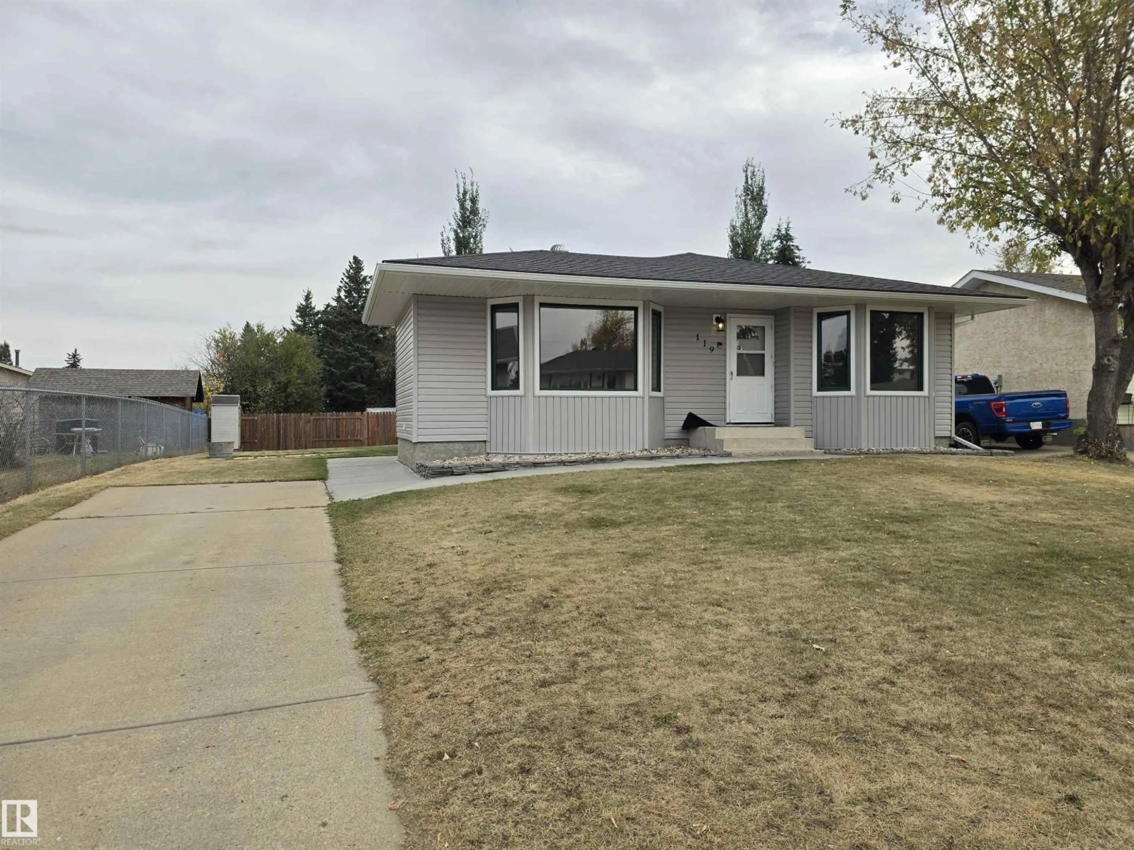 Home with vinyl exterior material, street for 119 DIAMOND DR, Millet Alberta T0C1Z0