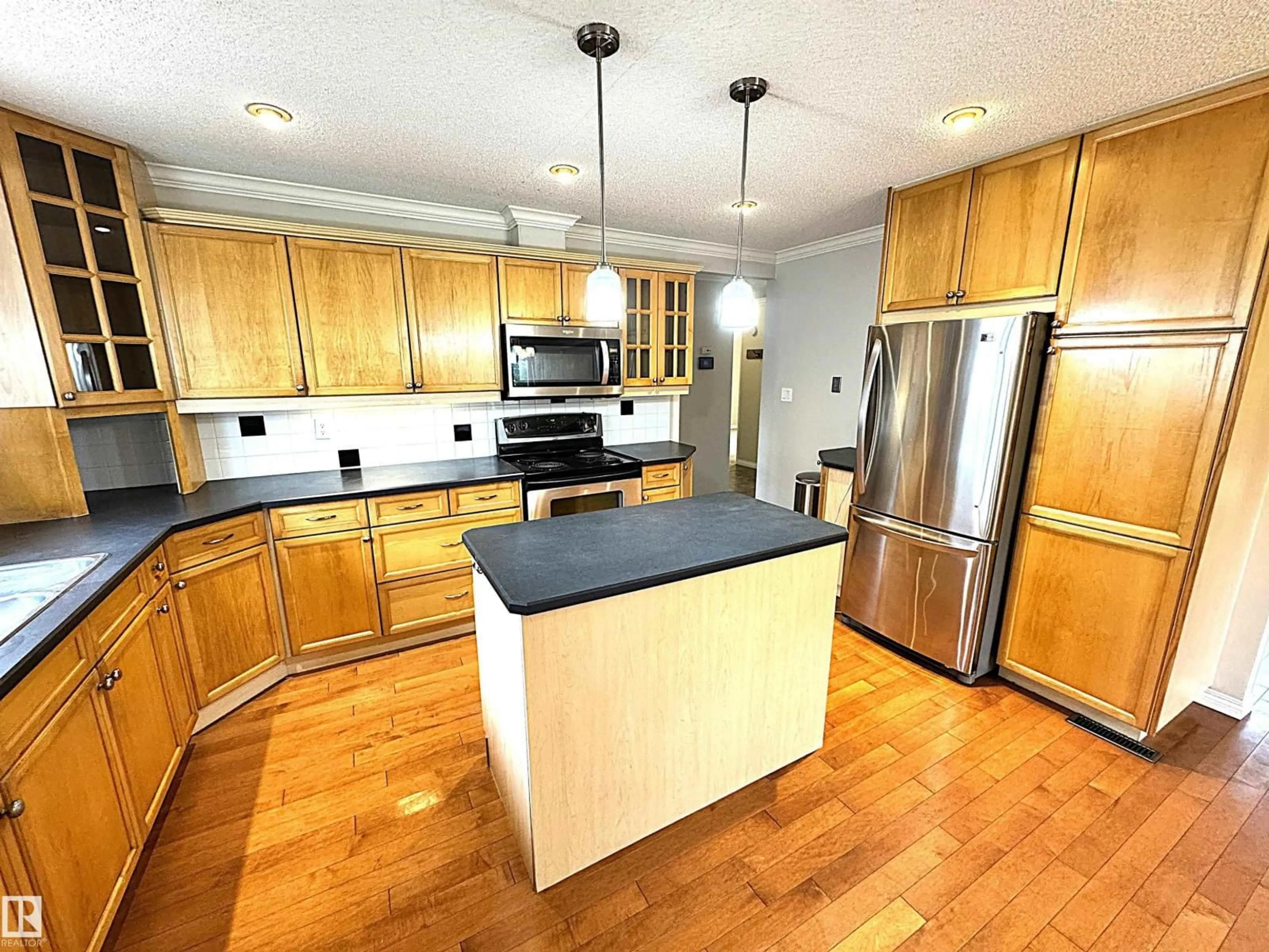 Open concept kitchen, wood/laminate floor for NW - 3607 104 ST, Edmonton Alberta T6J2J8