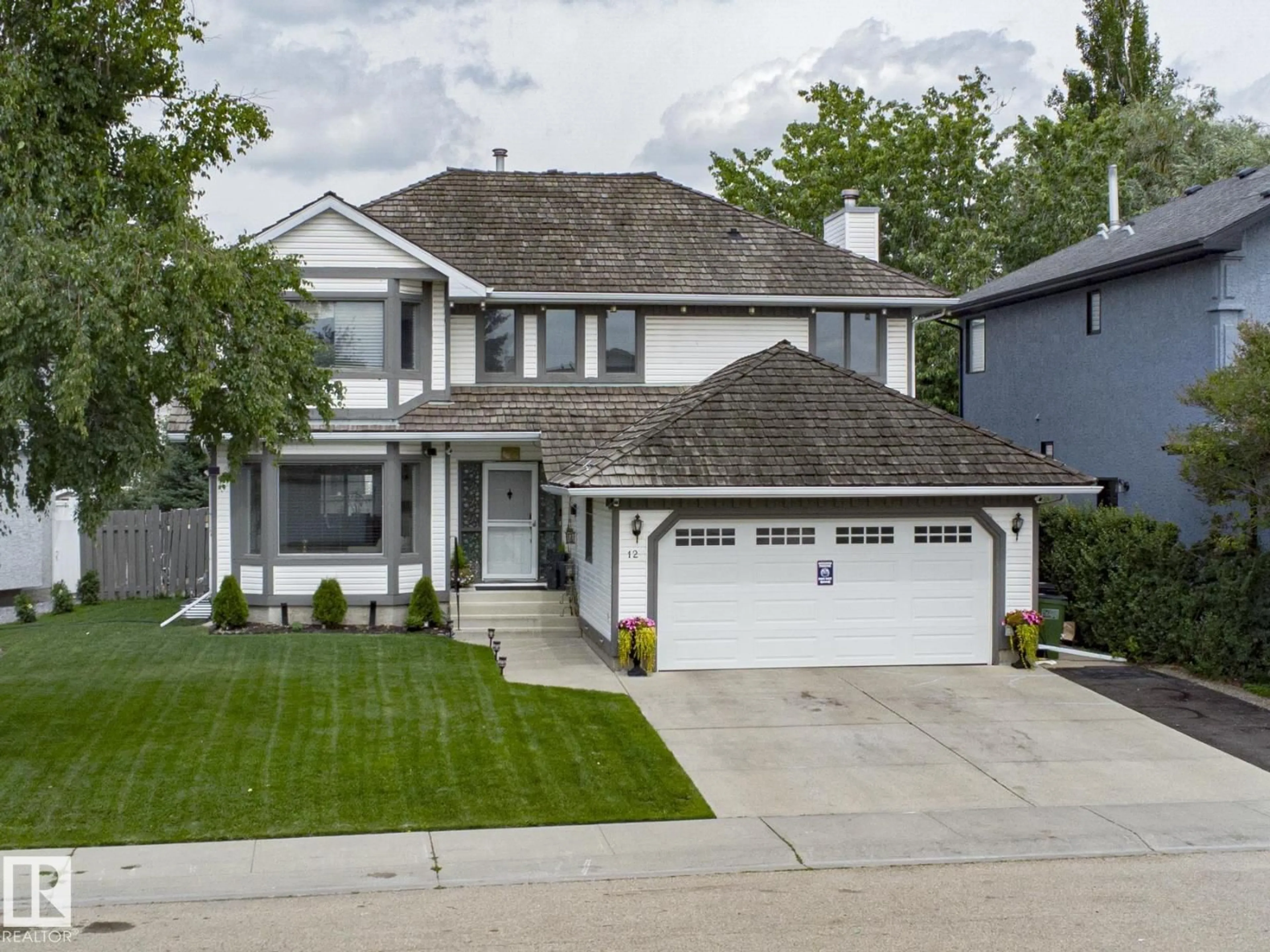 Home with vinyl exterior material, street for 12 ELSINORE PL, Edmonton Alberta T5X5W3