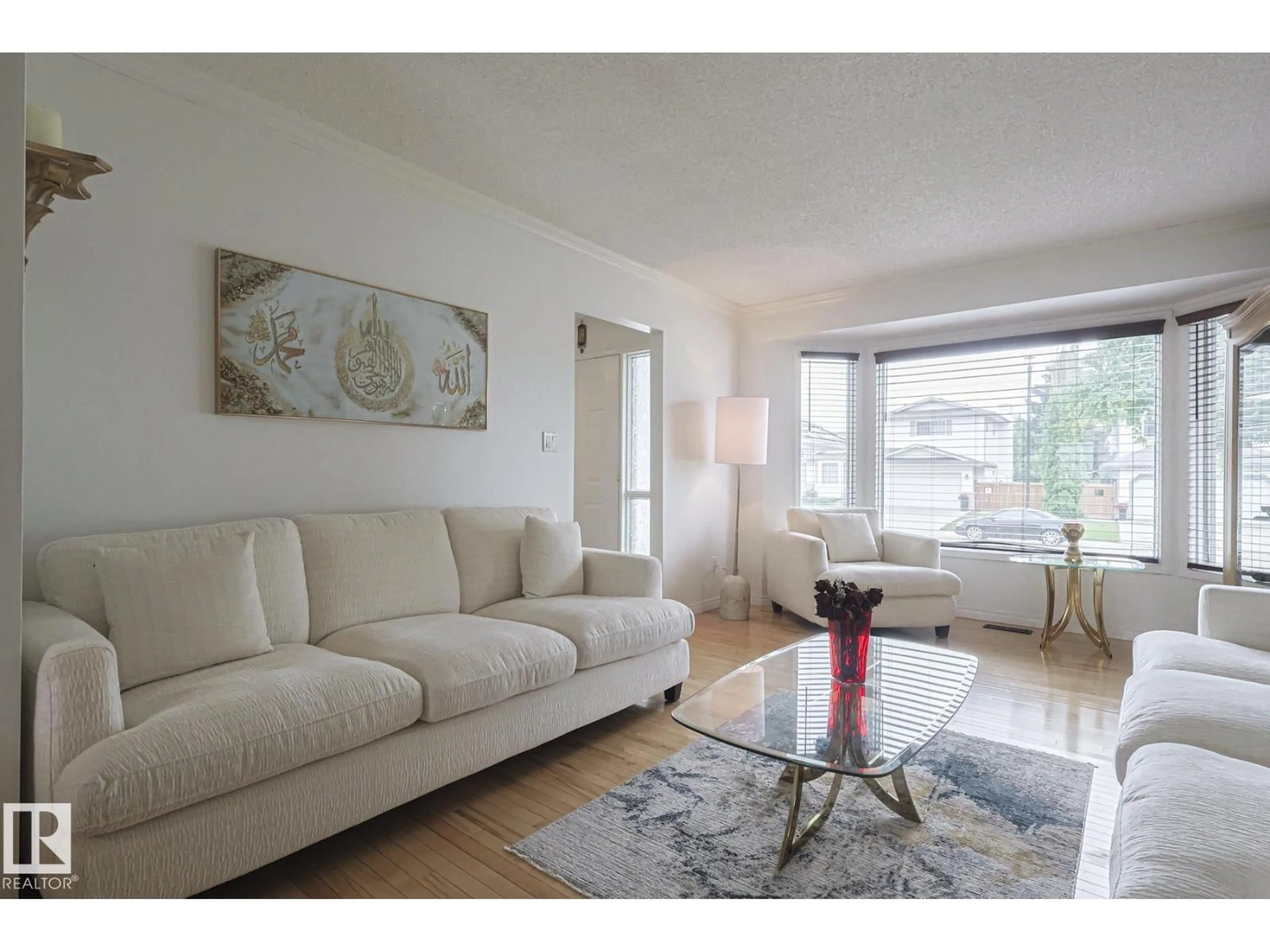 Living room with furniture, wood/laminate floor for 12 ELSINORE PL, Edmonton Alberta T5X5W3