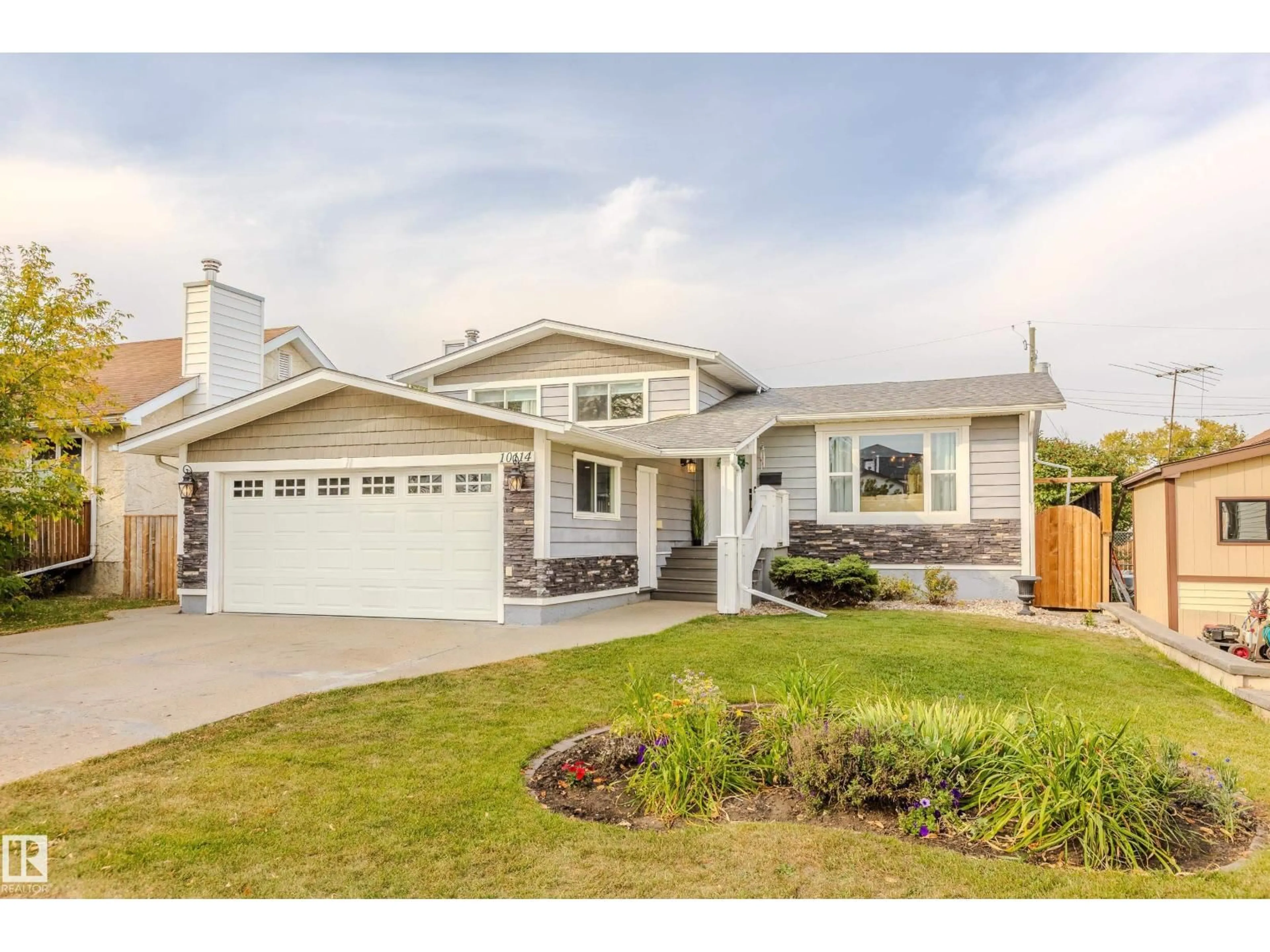 Home with vinyl exterior material, street for 10114 102 AV, Morinville Alberta T8R1A7