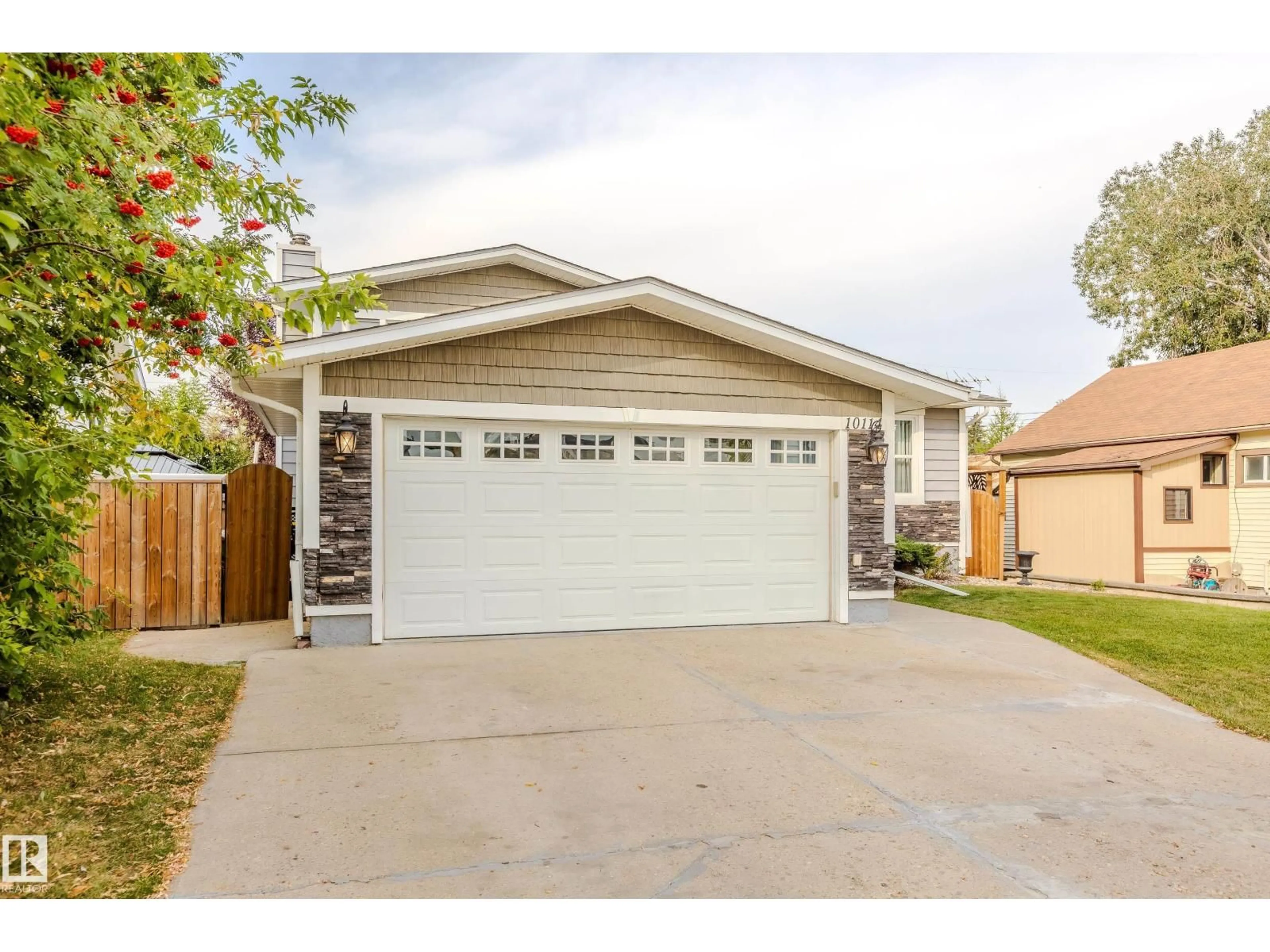 Home with vinyl exterior material, street for 10114 102 AV, Morinville Alberta T8R1A7
