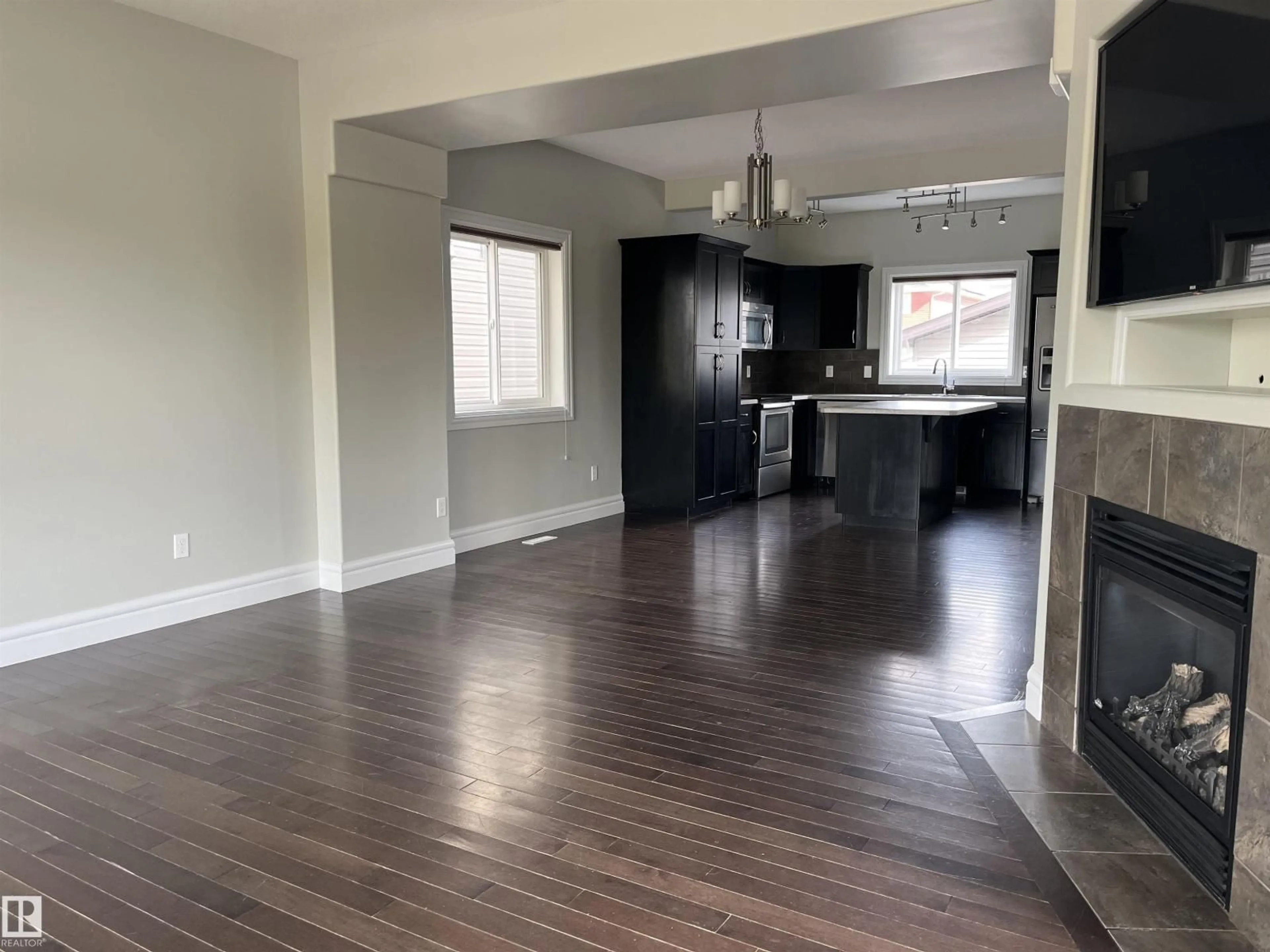 Open concept kitchen, wood/laminate floor for 303 SHERIDAN WY, Leduc Alberta T9E8R9