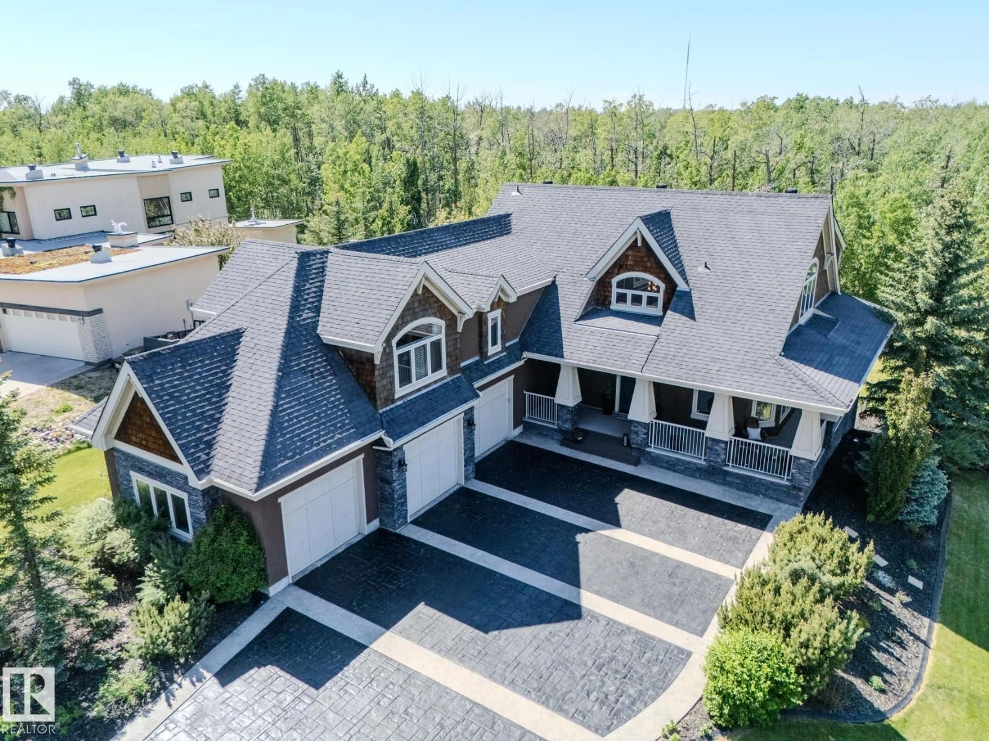 A pic from outside/outdoor area/front of a property/back of a property/a pic from drone, unknown for 23033 - 27 WYE RD, Rural Strathcona County Alberta T8B1H9