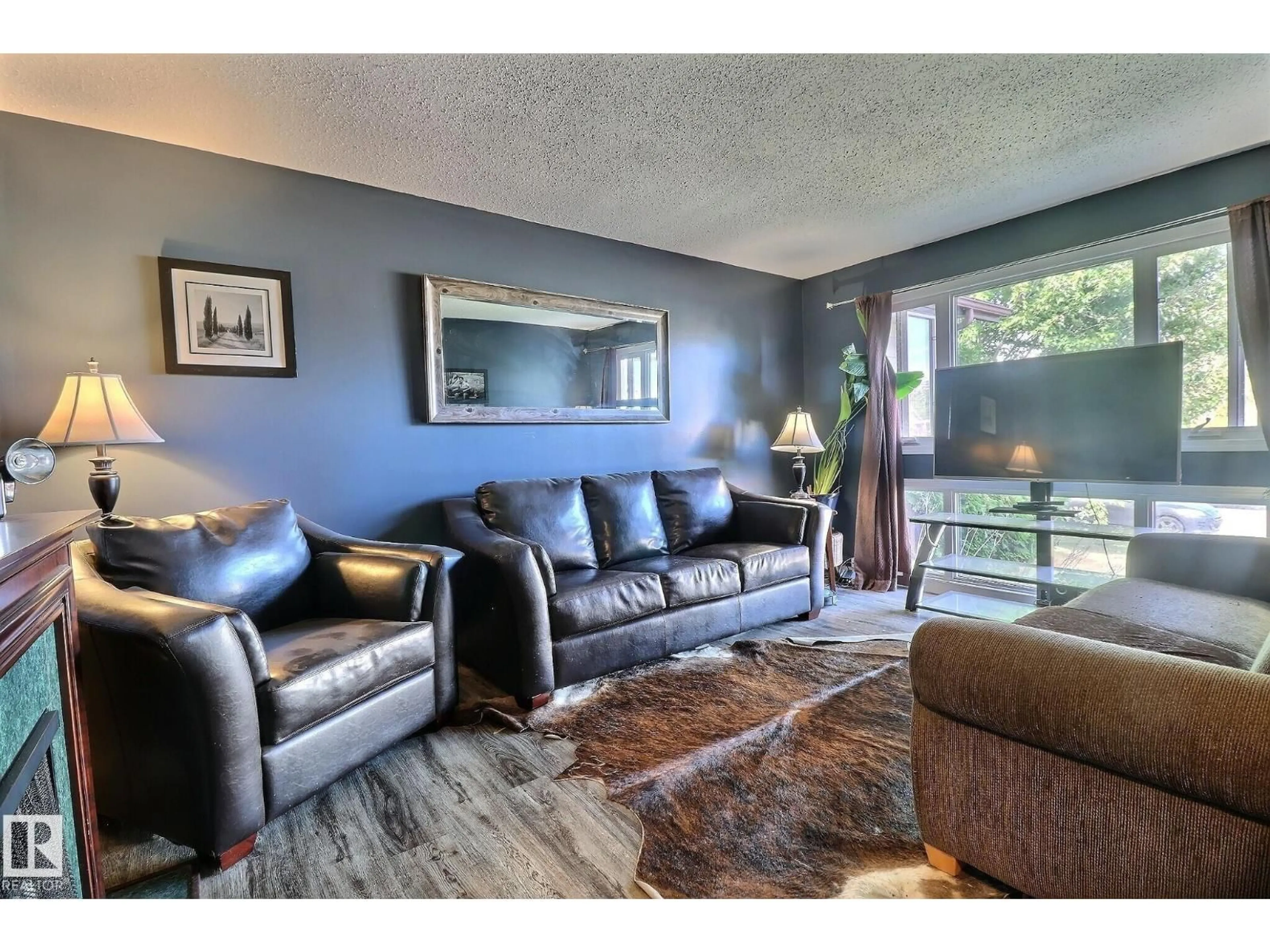 Living room with furniture, unknown for 5315 39 AV, Edmonton Alberta T6L1P3