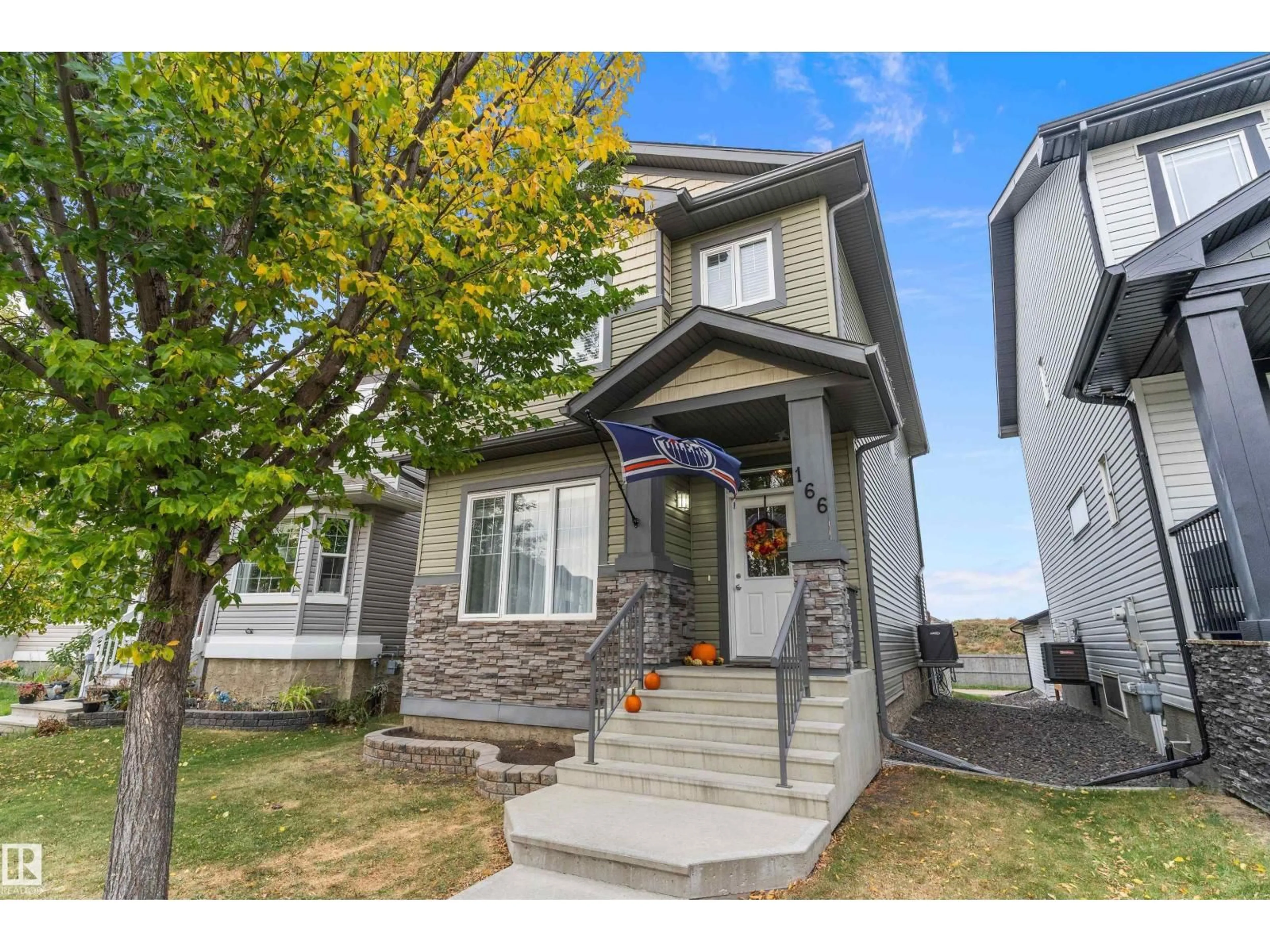Home with vinyl exterior material, street for 166 KIRPATRICK WY, Leduc Alberta T9E0Z2