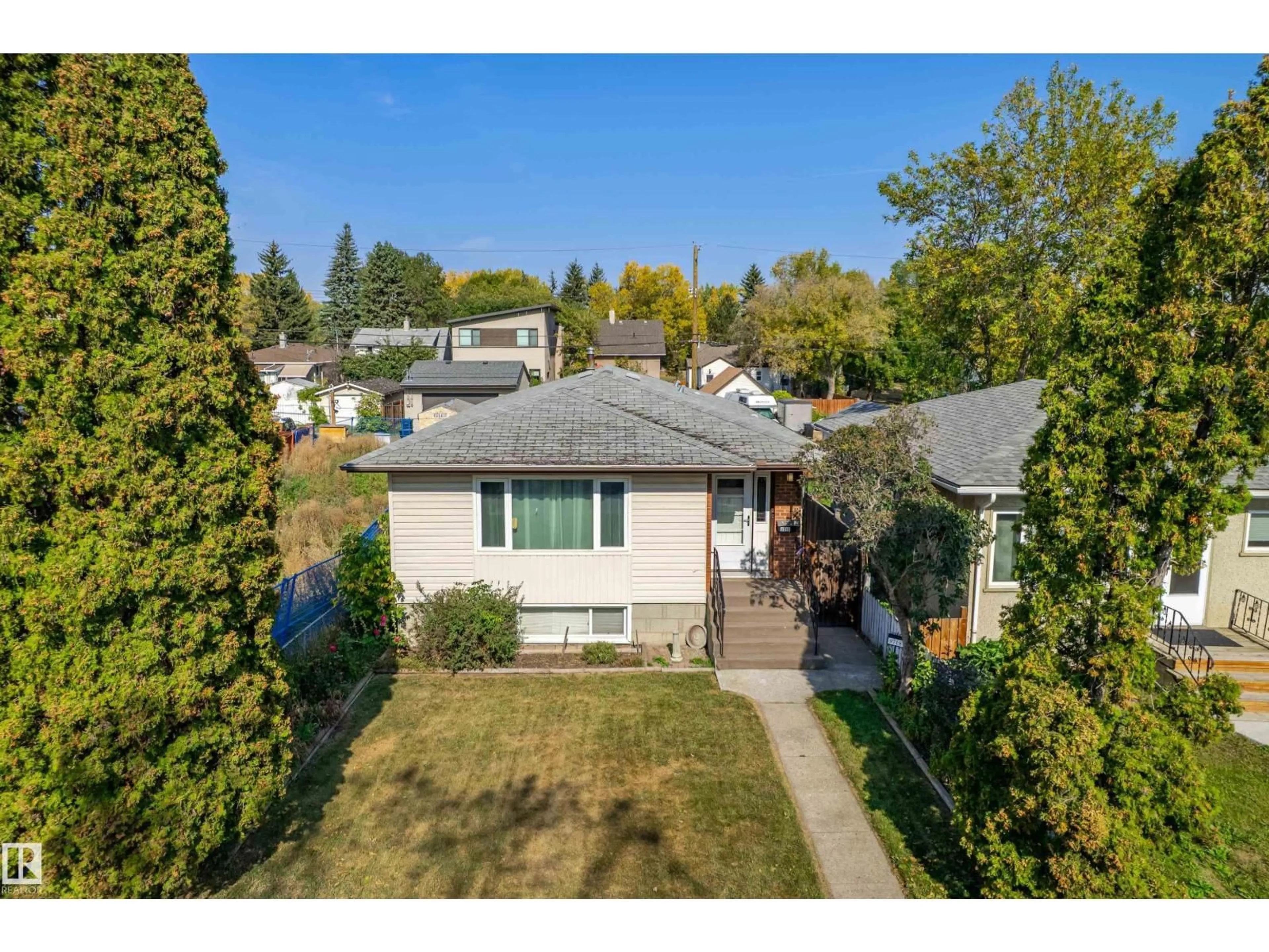 A pic from outside/outdoor area/front of a property/back of a property/a pic from drone, street for 9718 76 AV, Edmonton Alberta T6E1K3