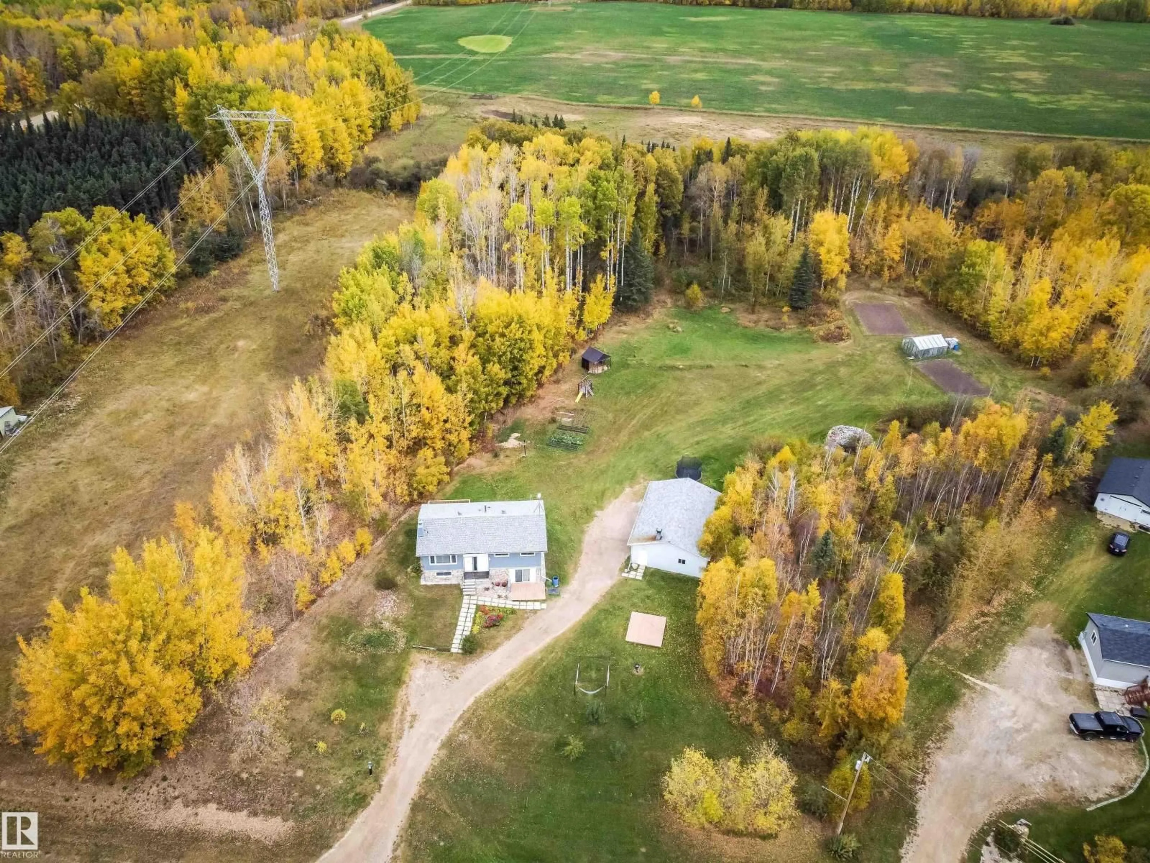 A pic from outside/outdoor area/front of a property/back of a property/a pic from drone, forest/trees view for #4 - 54227 RGE ROAD 41, Rural Lac Ste. Anne County Alberta T0E0A1