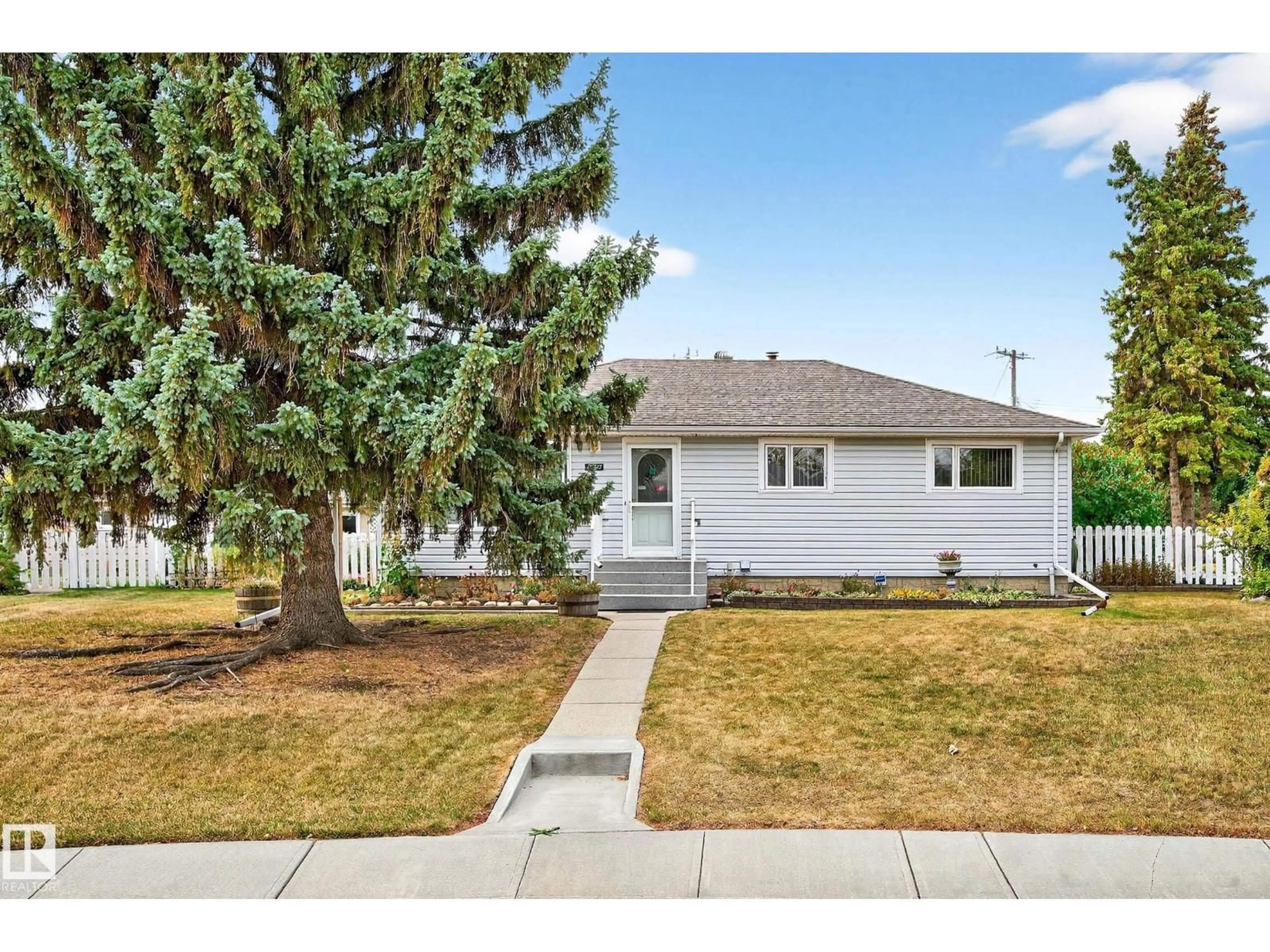 Home with vinyl exterior material, street for 10527 133 AV, Edmonton Alberta T5E1E2