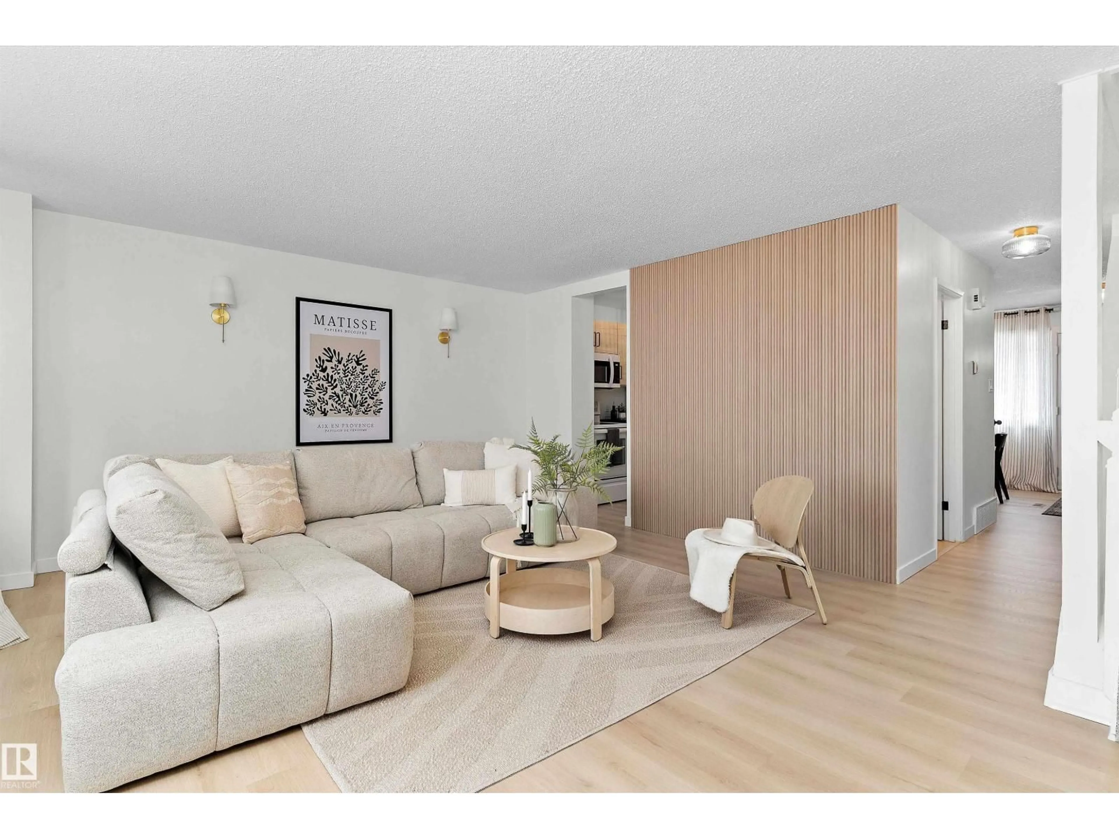 Living room with furniture, wood/laminate floor for 717 VILLAGE ON THE GREEN GR, Edmonton Alberta T5A1H2