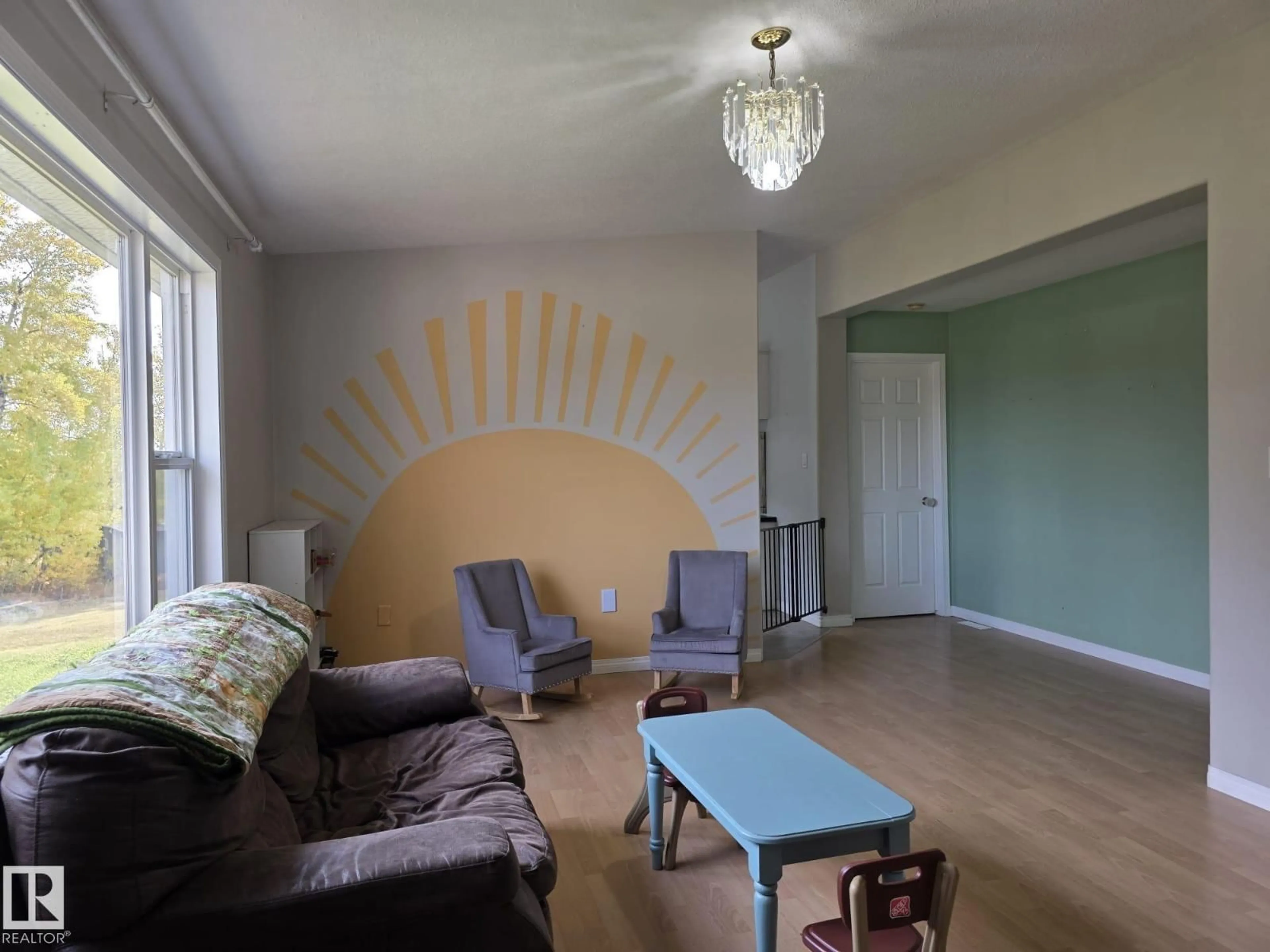 Living room with furniture, wood/laminate floor for 7215 TOWNSHIP RD 504, Rural Brazeau County Alberta T7A2A2