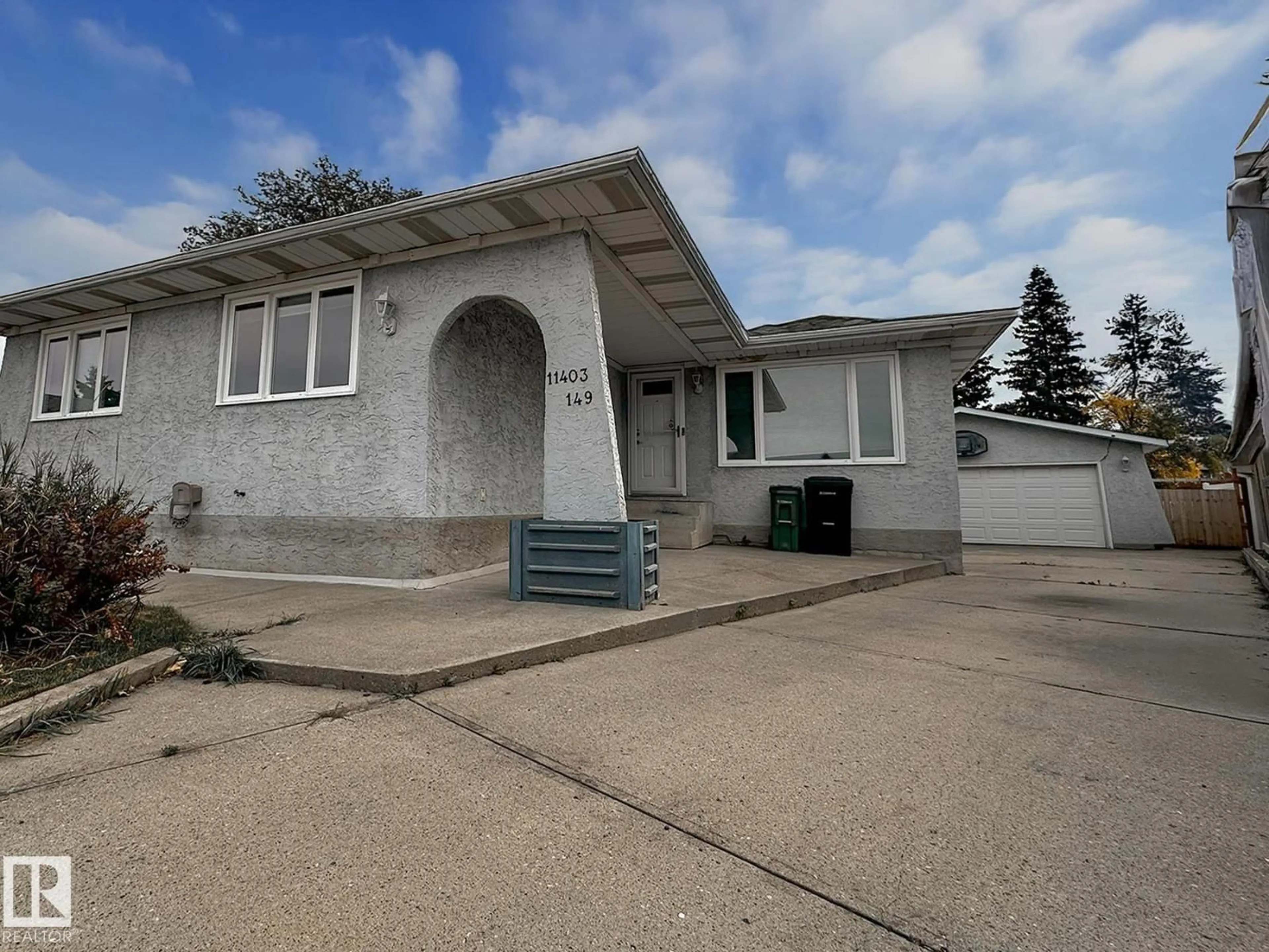 Home with vinyl exterior material, street for 11403 149 AV, Edmonton Alberta T5X1B9
